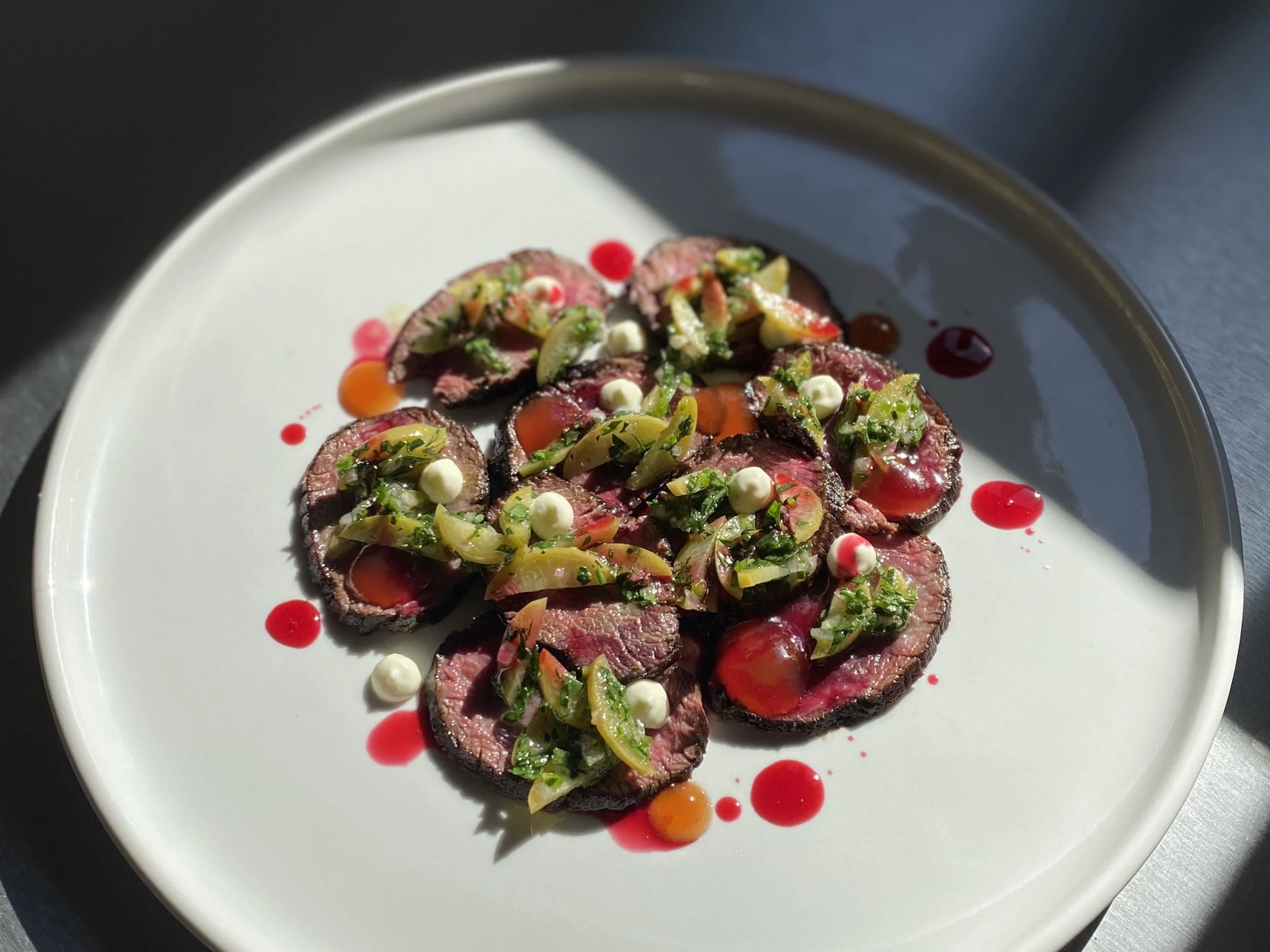 Wild Suffolk venison tartare with Husk's plum olives and molasses.jpeg