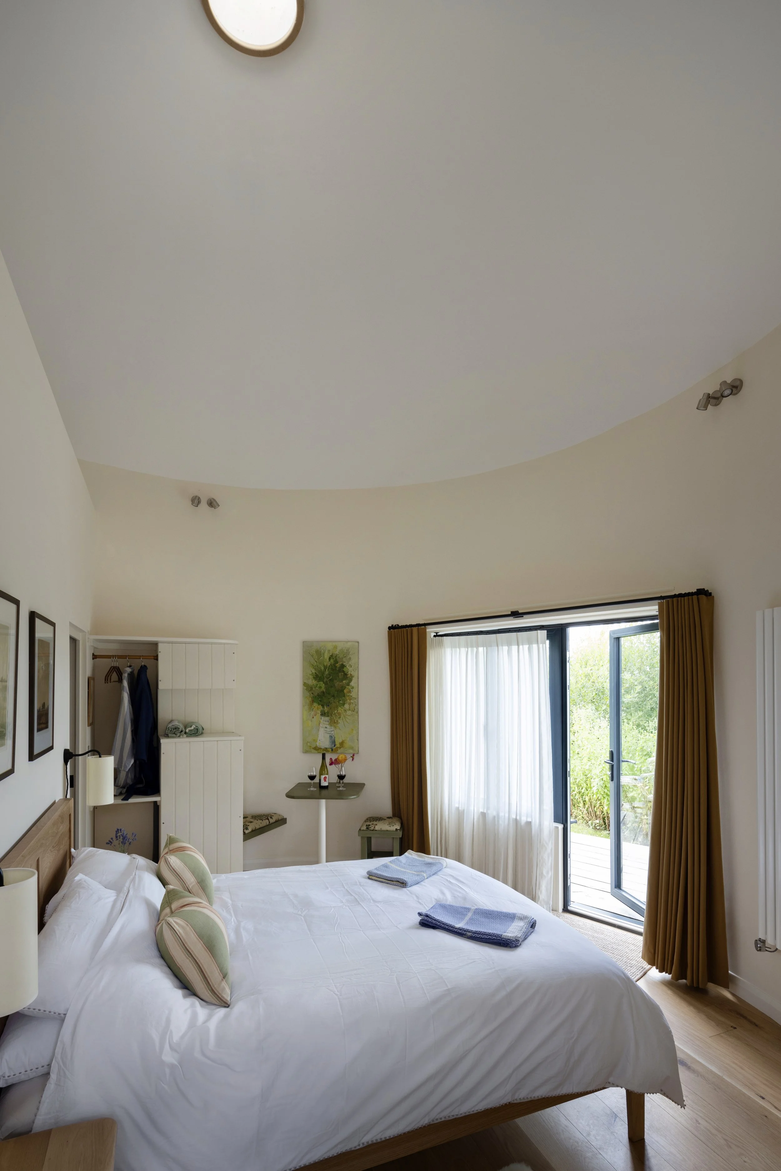 The original grain shoot at the top of the silo has been left in place as a skylight.