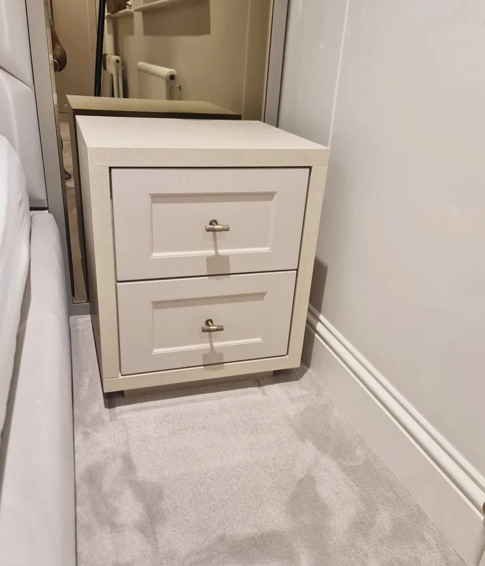 Close-up of beside table shoe storage drawers designed within a fitted wardrobe system, providing organised and accessible bedroom storage.