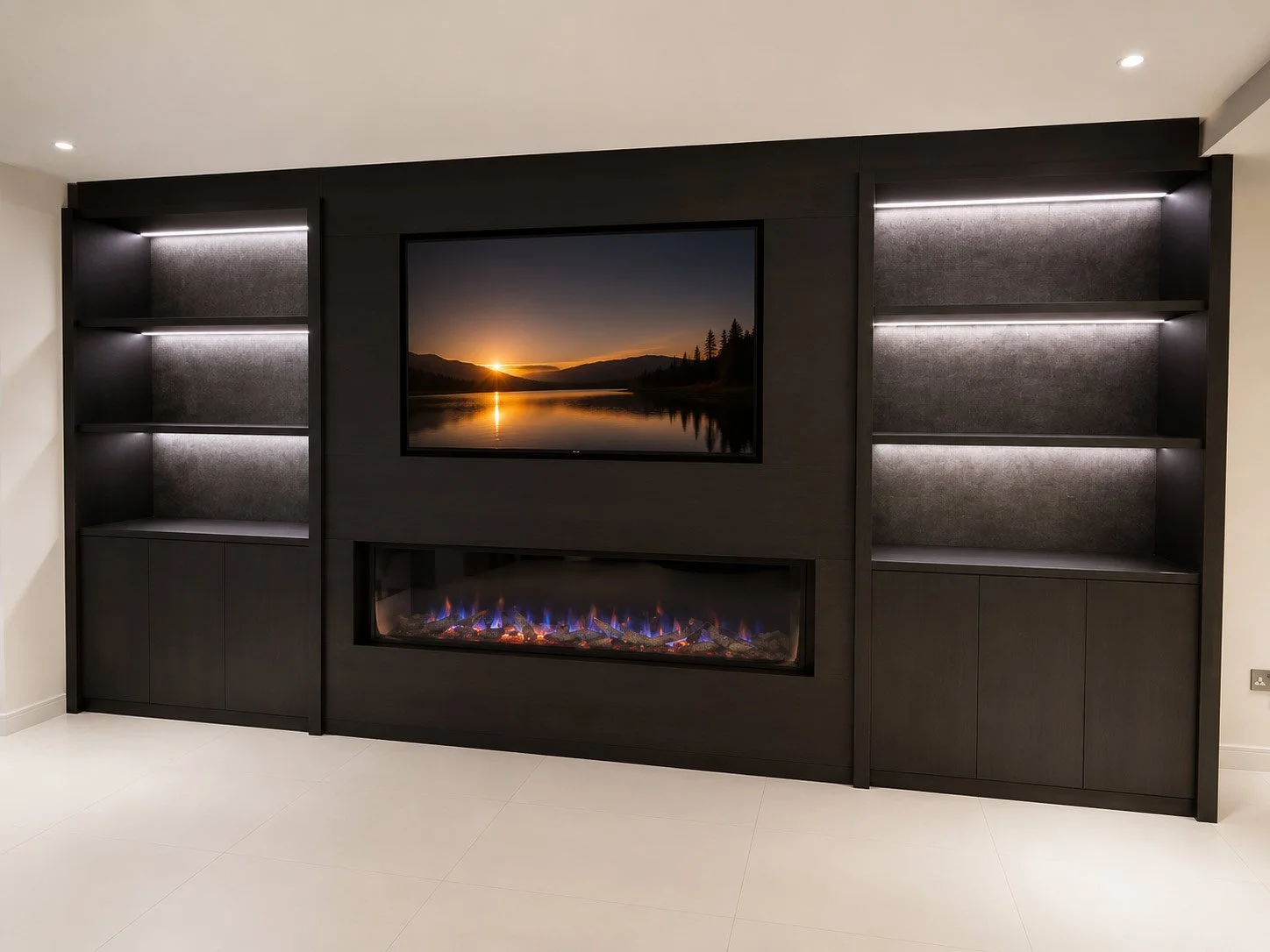 Bespoke media wall designed around symmetry, combining recessed television housing, integrated shelving and ambient lighting.