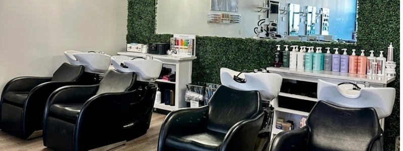 Modern luxury hair salon in Westminster Colorado showing clean styling stations and comfortable chairs