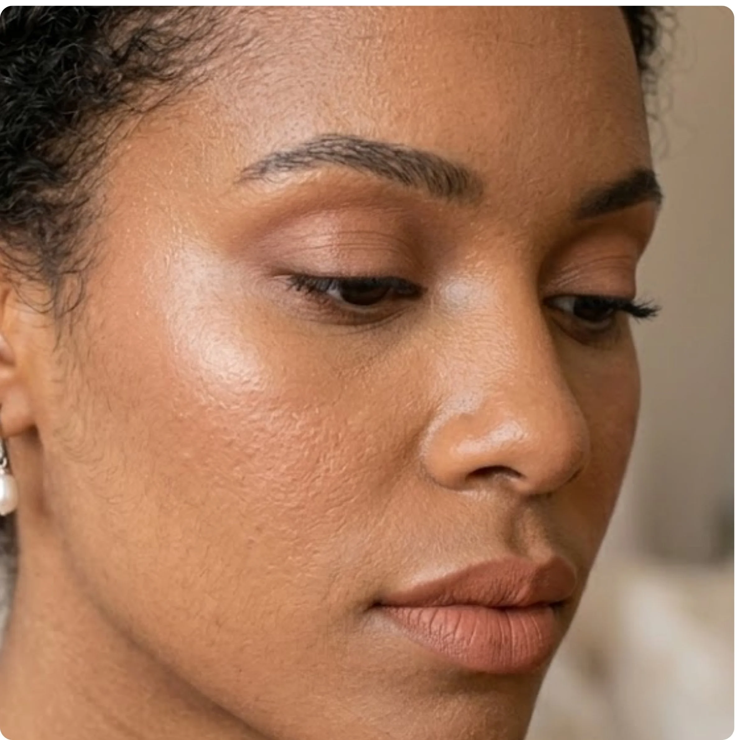 Monochromatic neutral bridal makeup look using matching soft peachy-pink tones on eyes, cheeks, and lips for a minimalist aesthetic.