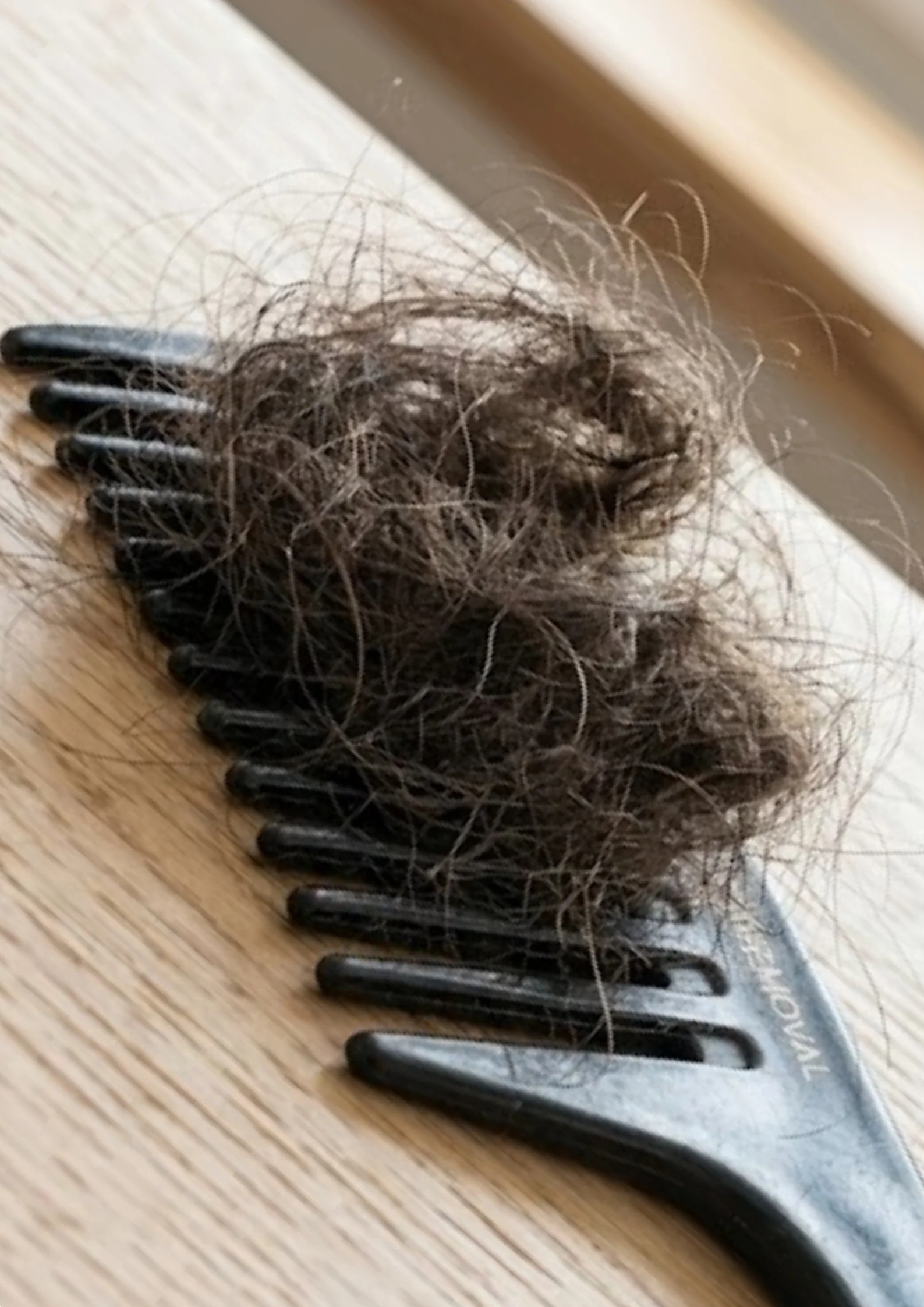 Natural hair shedding after removing sew-in extensions to explain normal hair loss