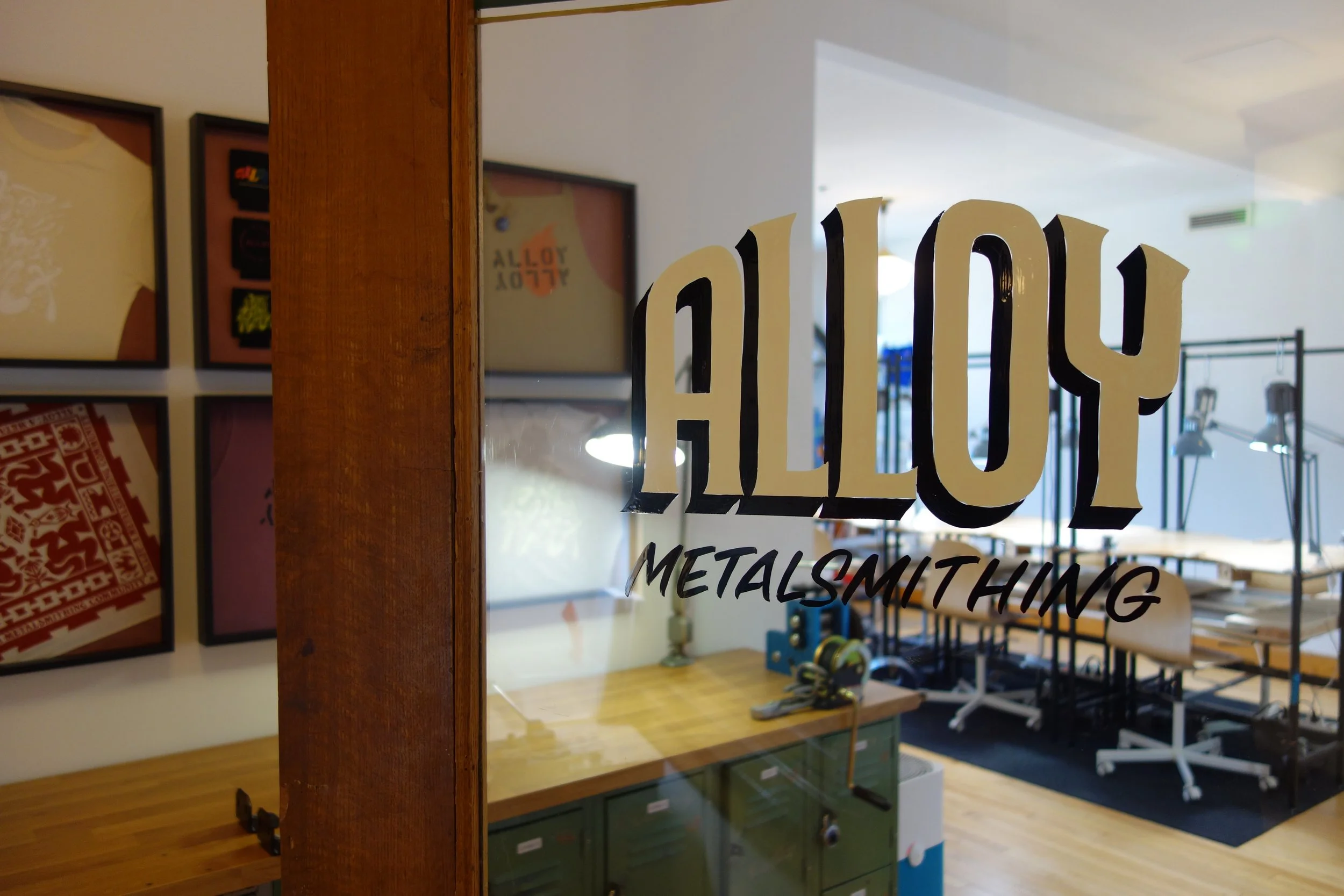 Front door with shared studio benches in the background