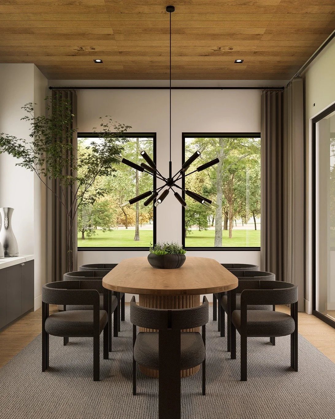 Framed by floor-to-ceiling windows, this dining space celebrates both design and nature. 🌿✨ The sleek lines, natural textures, and bold chandelier create a perfect balance of modern elegance and warmth. 

Would you enjoy your meals with this view? ?