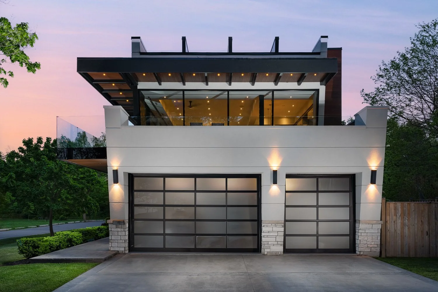 close-up of the two garage doors at sunset of the Meadow Wood residential architectural project in Mississauga, Ontario