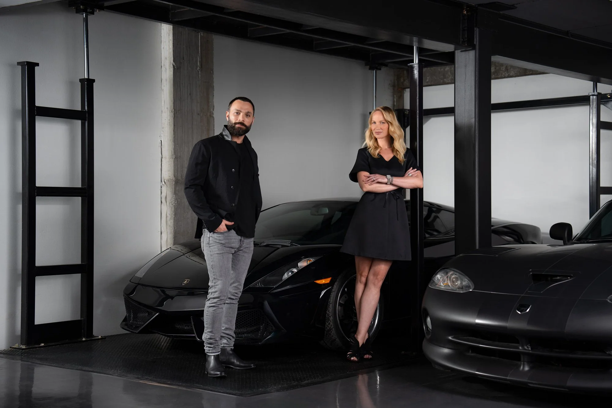 The Stamp & Hammer architects, Mitch and Berit, standing inside the garage of the Meadow Wood residential architectural project in Mississauga, Ontario