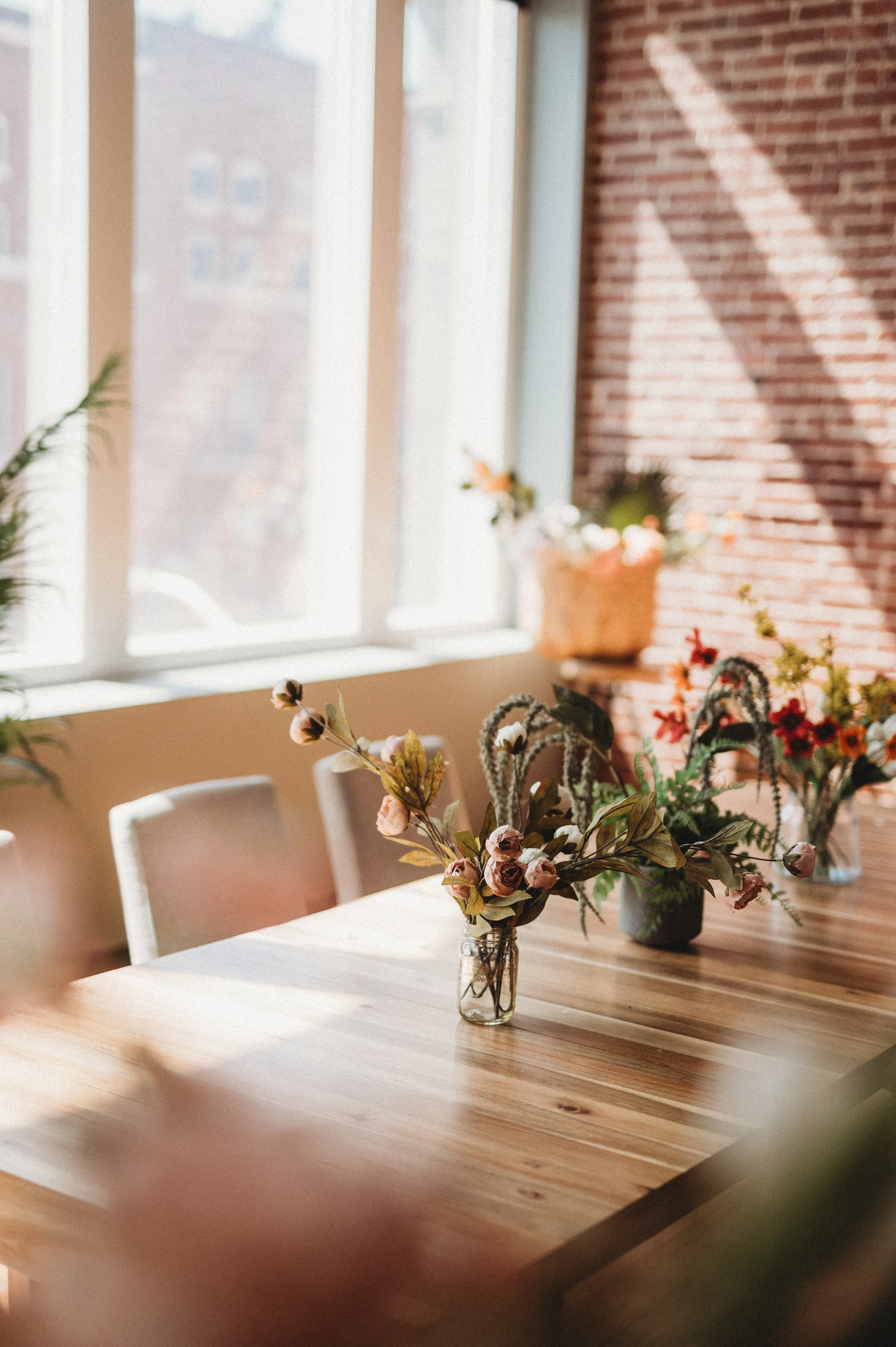 flowers on a long table by New Hampshire boudoir photographer