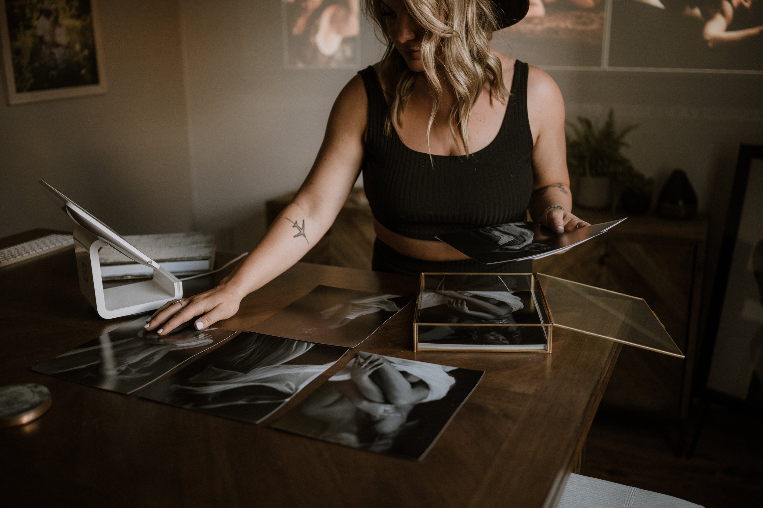 Hannah selecting photographs for glass folio case