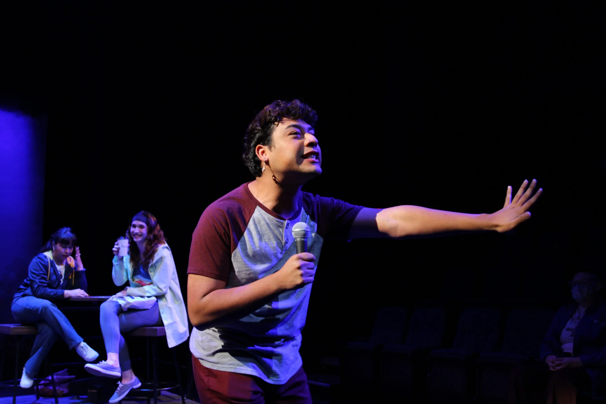 Lechuga MCing Spoken Word night