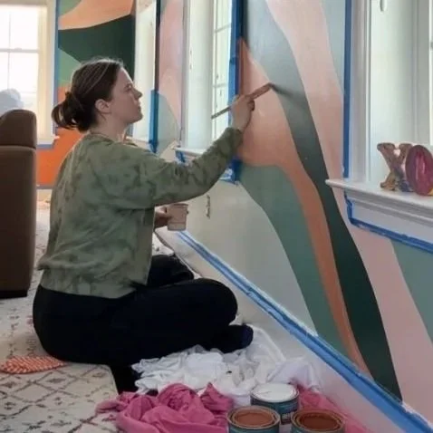 Woman Artist Painting Mural in Kids Playroom Howard County Maryland