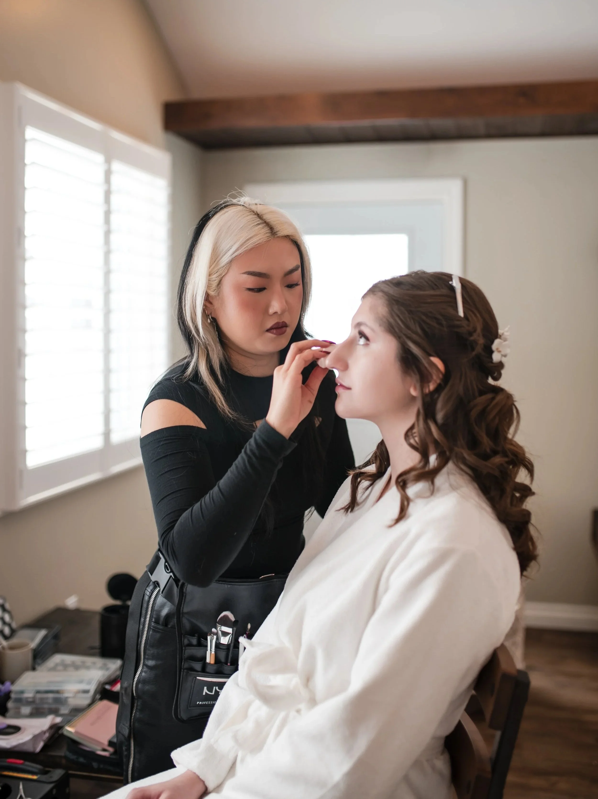 Ottawa Makeup Artist and Hairstylist working on a bride