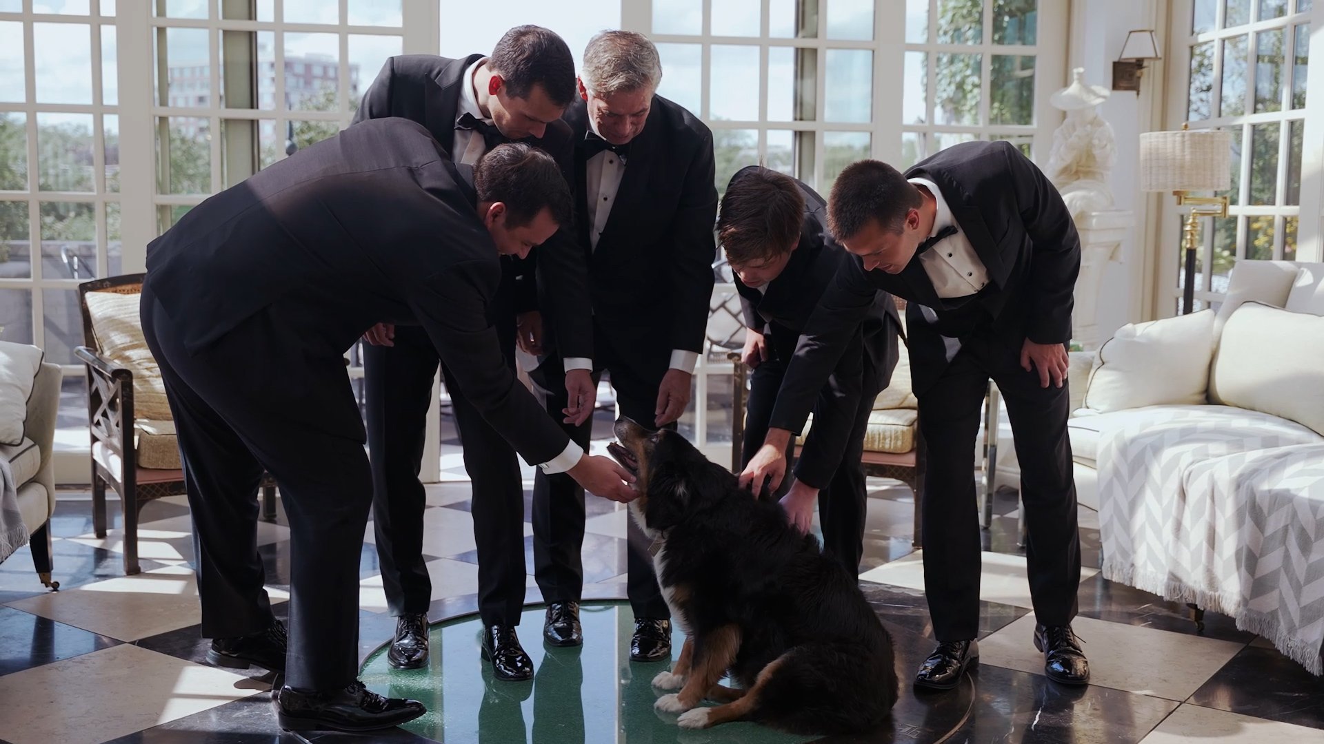 groomsmen petting dog