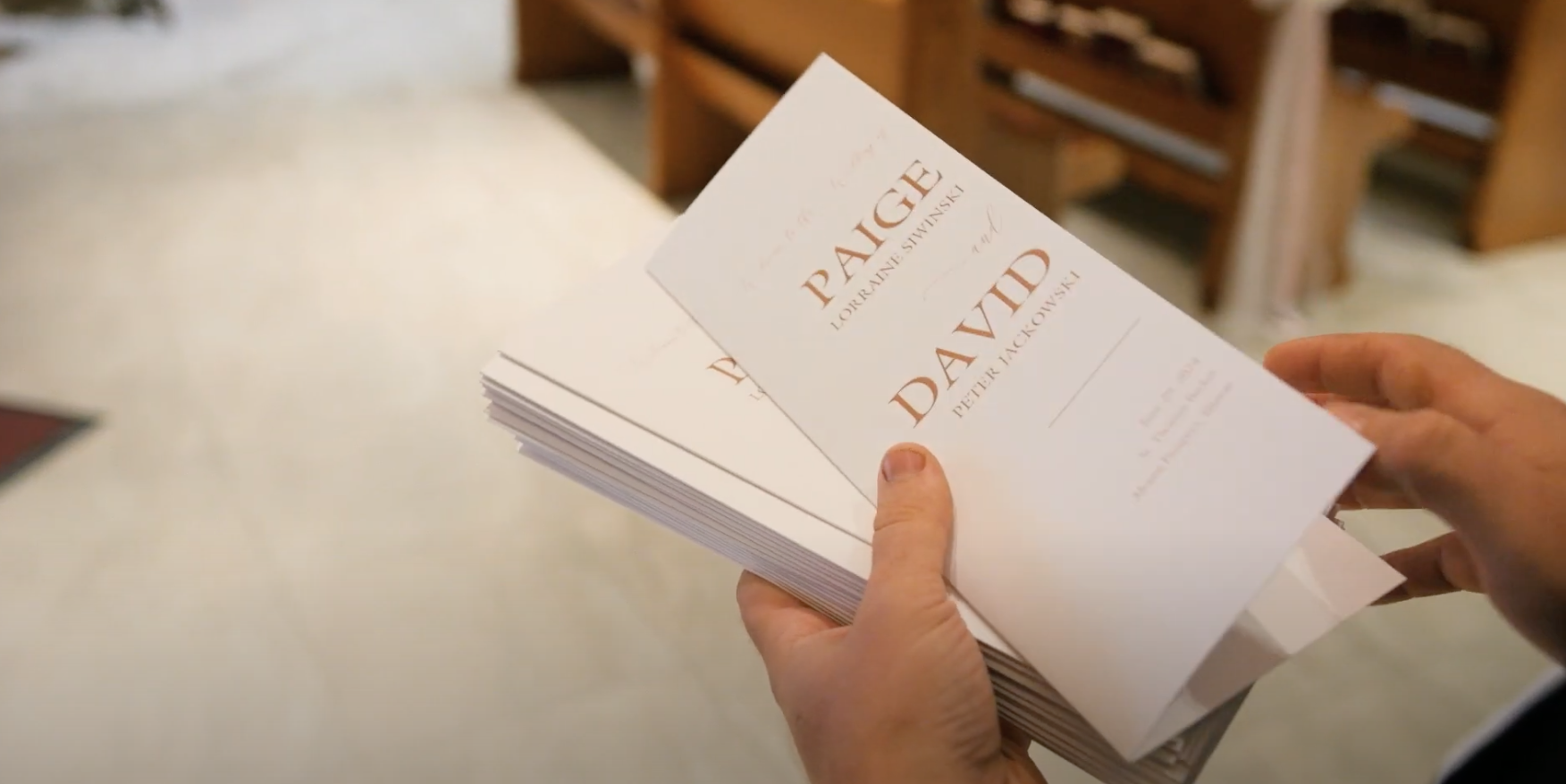 A person holding a stack of paperback books titled "Pale Dawn" by Lorraine Sivinski with the author's name "Petra Jackson" visible on the cover.