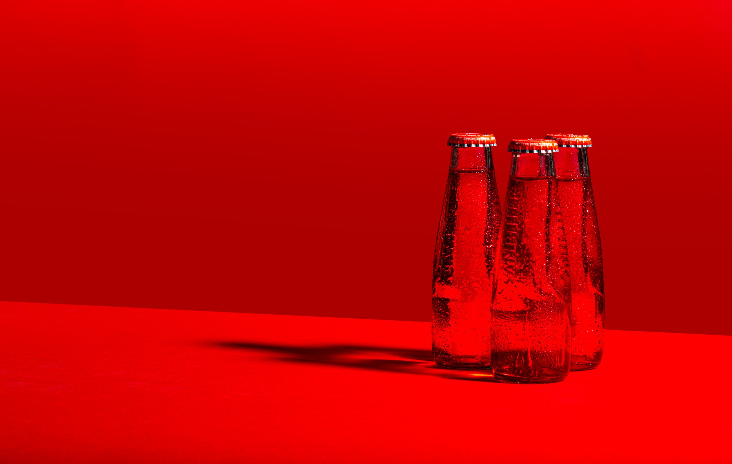 Ice cold sanbitter trio on red background