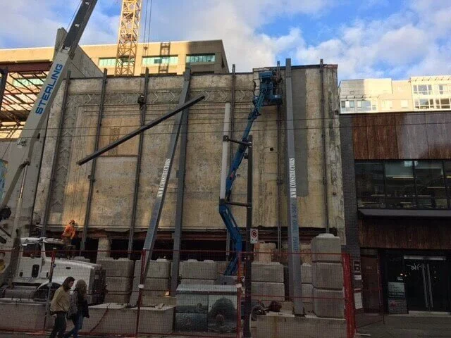 Crane and steel retention frame supporting the Coronet Theatre façade