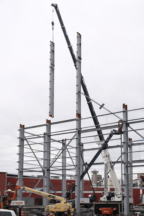 Steel structure rising on construction site