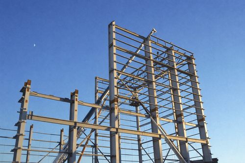 Building under construction at sunset