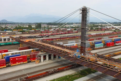 Coast Meridian Overpass — bridge launch operation with cranes