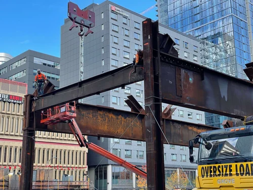WSCC Addition — ironworkers on steel