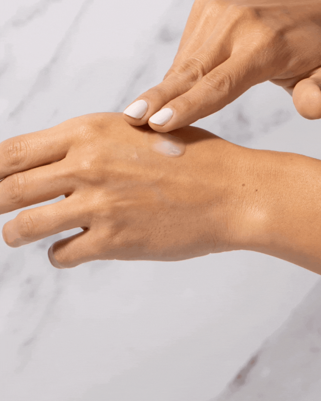 A gif of someone applying Alastin HA (Hyaluronic Acid) IMMERSE Serum™