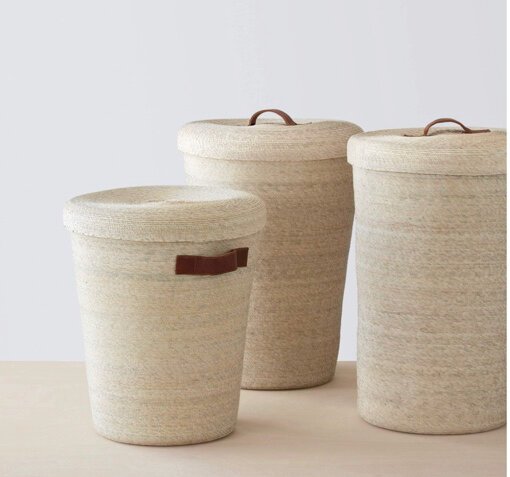 Palm leaf and leather handle laundry hampers from Guerrero, via The Citizenry