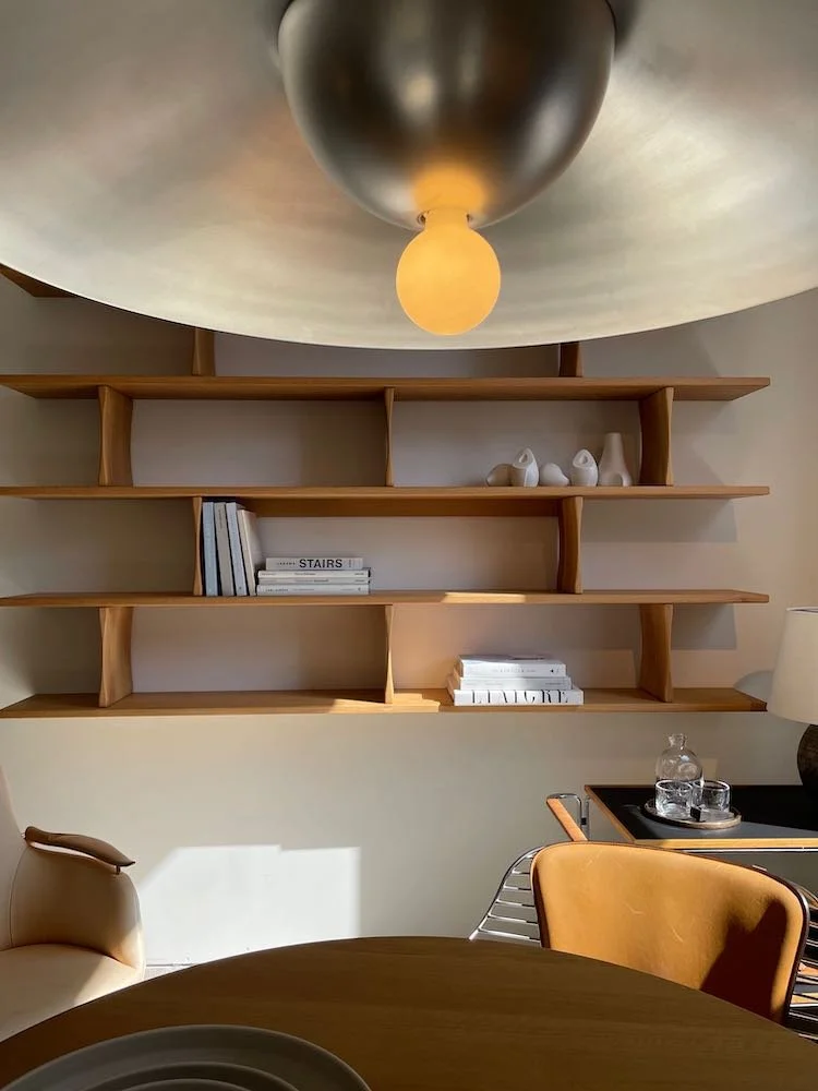 Modern wall-mounted bookshelves at FAIR design showroom in D&D