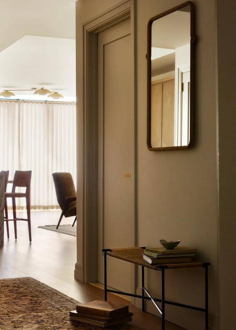 Hallway with Scandinavian design bench and luxury contemporary mirror