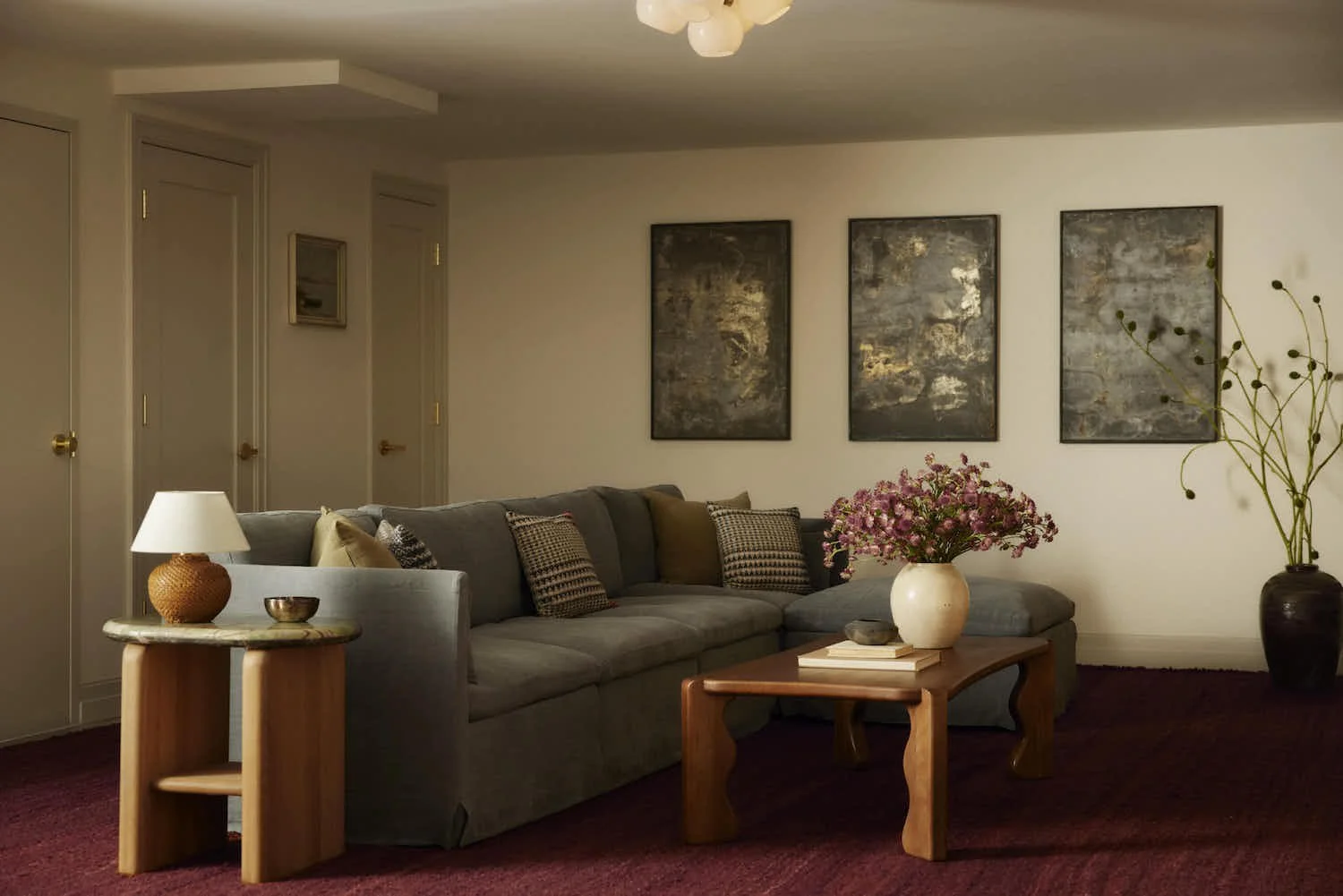Quiet, calming living room design with vintage art and handmade area rug