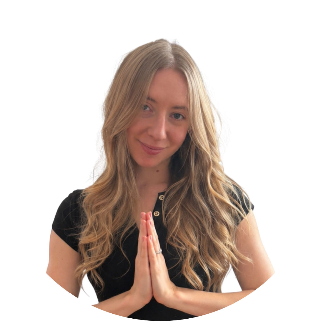 Headshot of Christina from the shoulders up softly smiling with prayer hands.