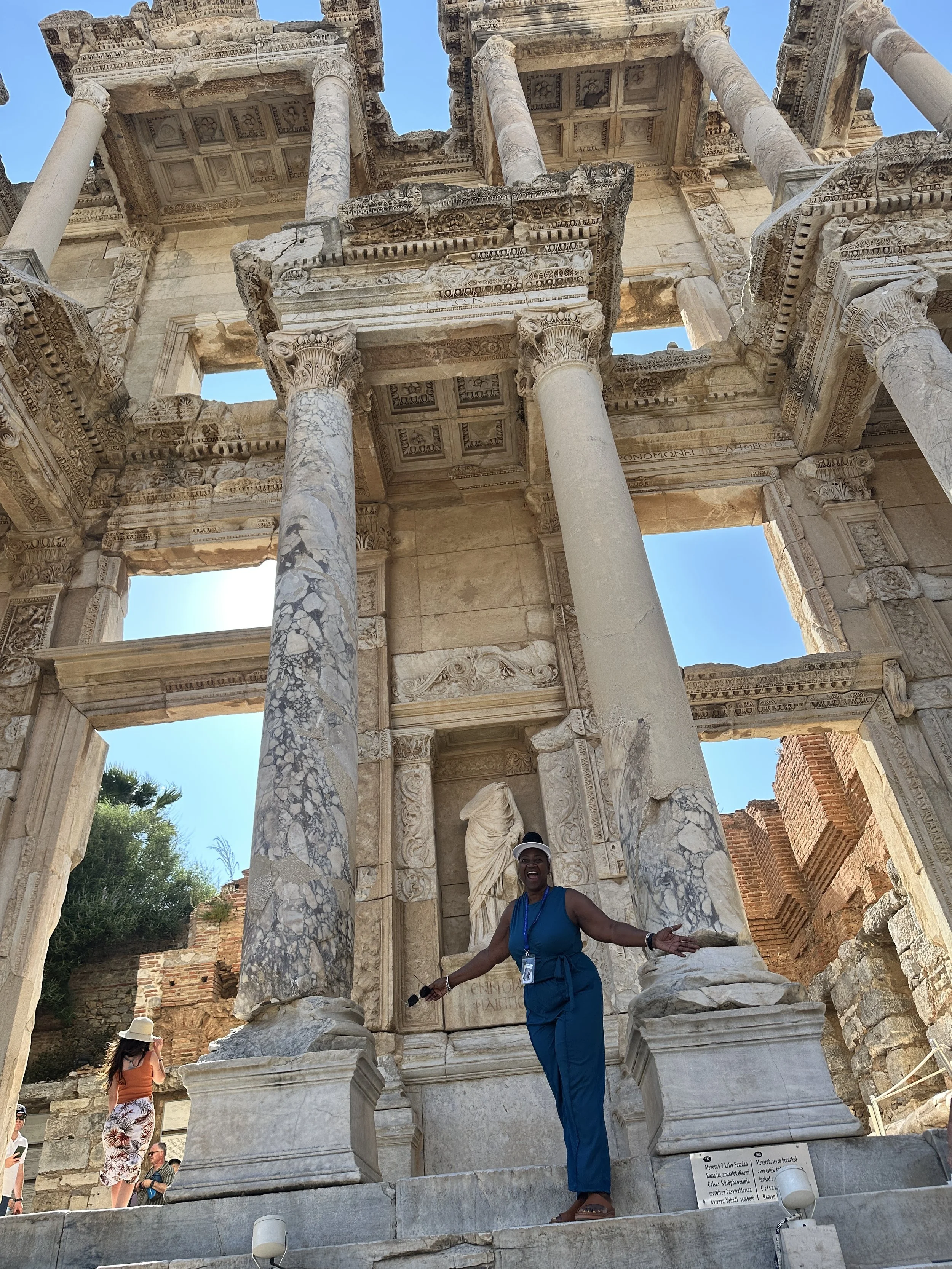 Group of people riding Segways near Arc de Triomf in Barcelona under a clear blue sky.