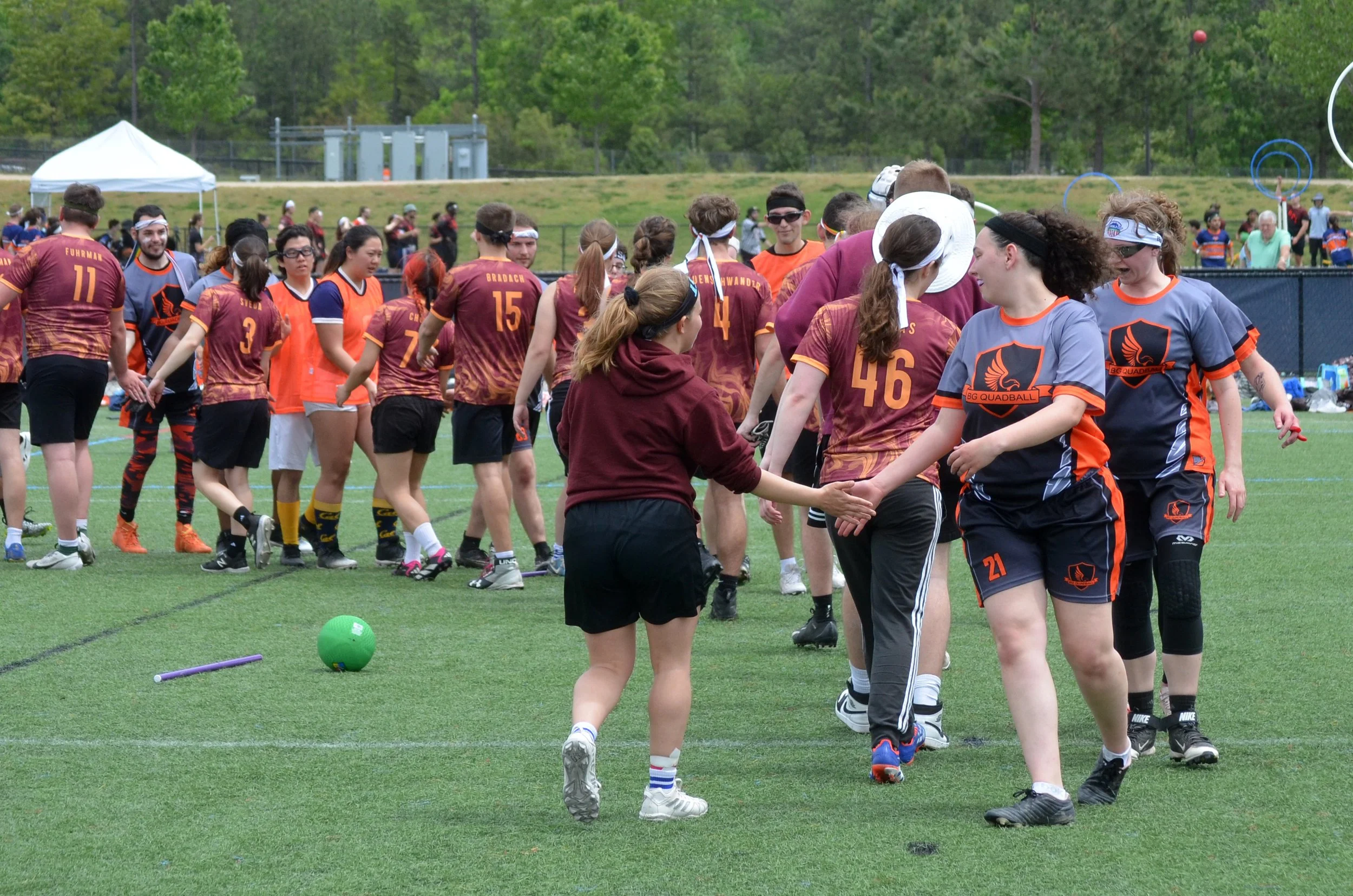 Opponents exchange high-fives after the game