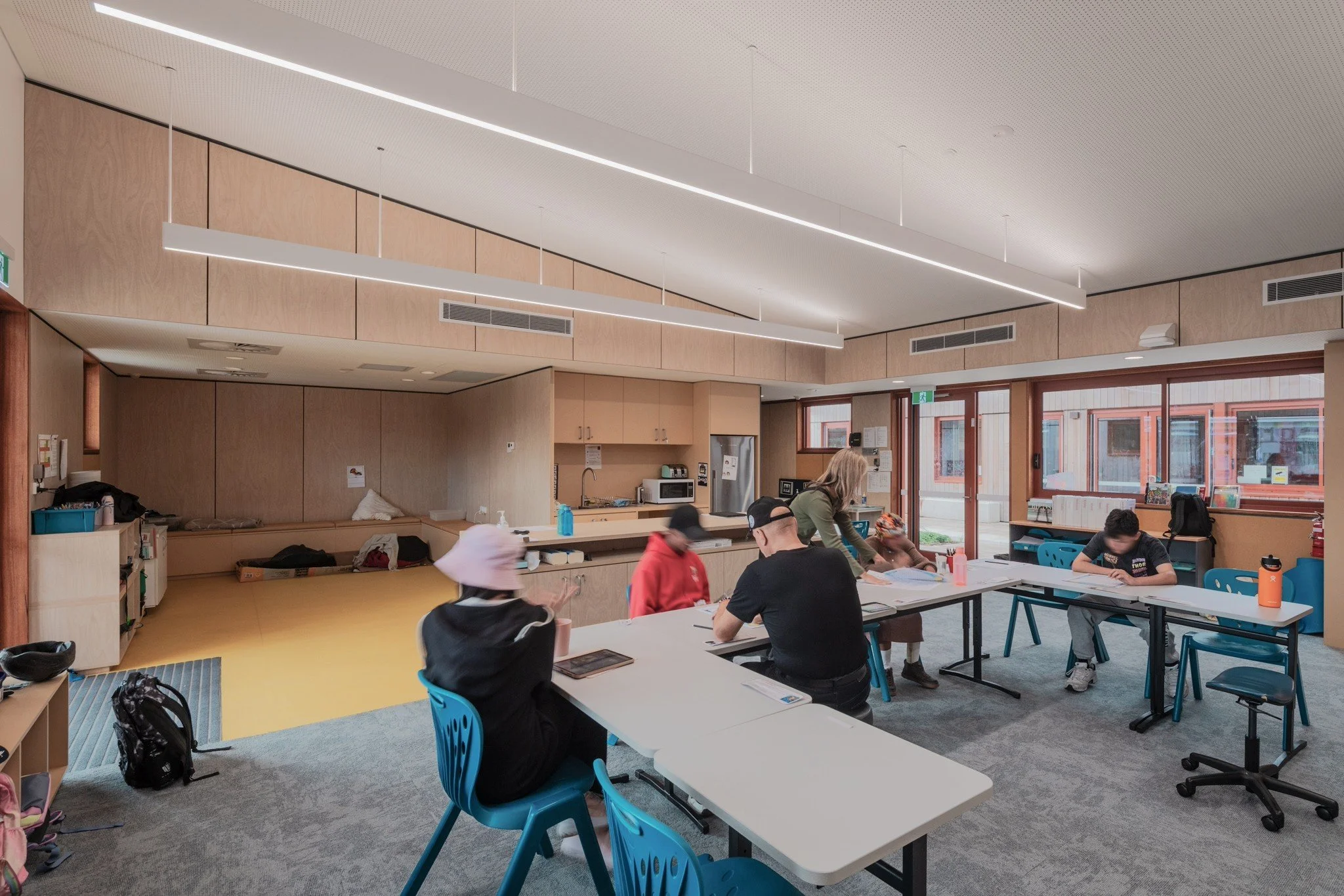 Students learning and interacting within a completed inclusive classroom, illustrating how research, expertise, and lived experience can create environments where people thrive.