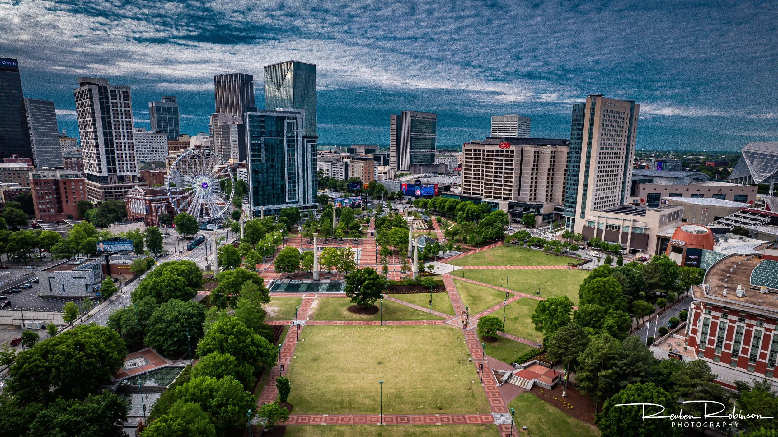Aerial view of Centennial Olympic Park in Atlanta with Ferris wheel and skyline.