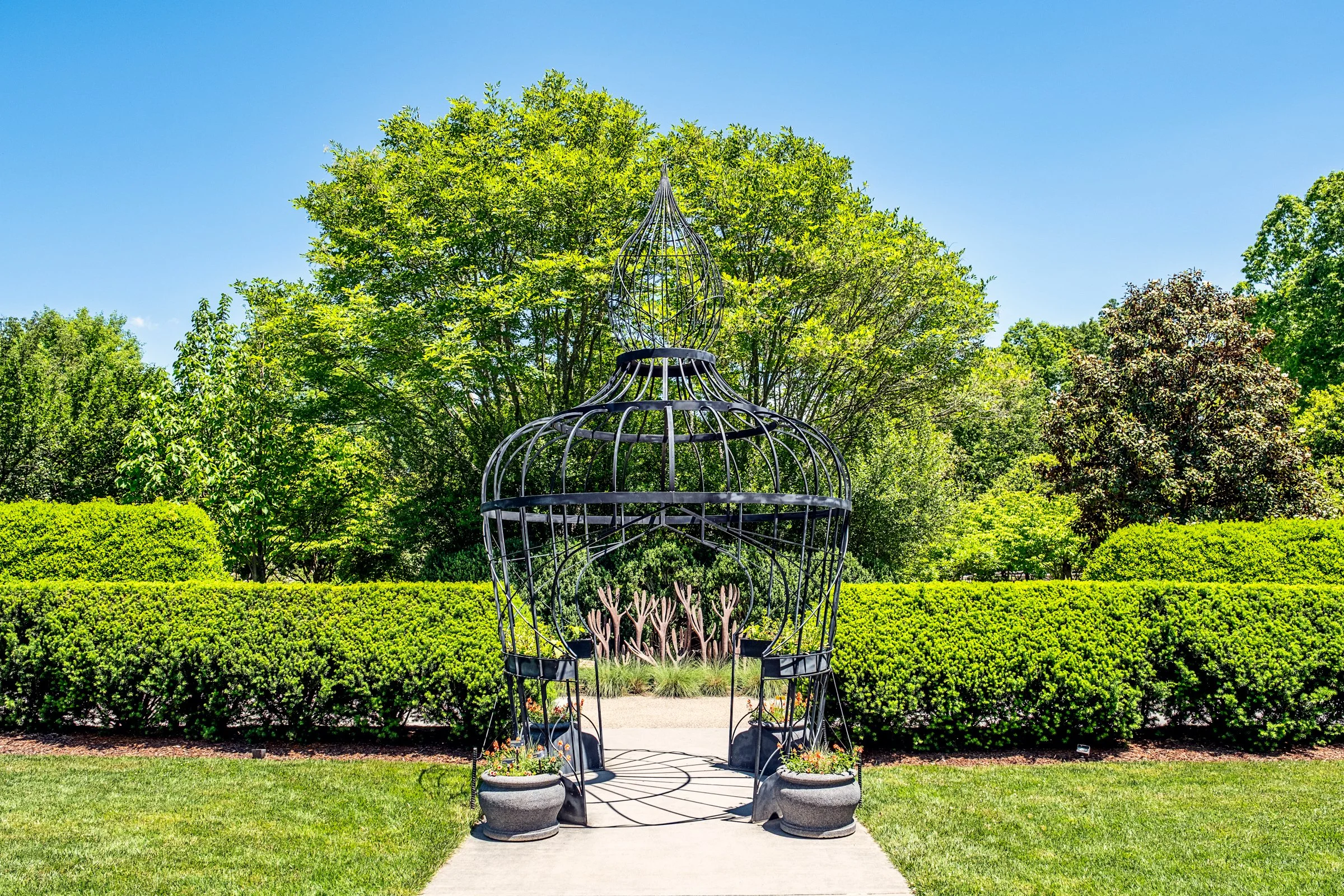 A quiet garden path and bonsai display at the North Carolina Arboretum near Asheville, North Carolina. Photographed by Lange Photo Studio. 