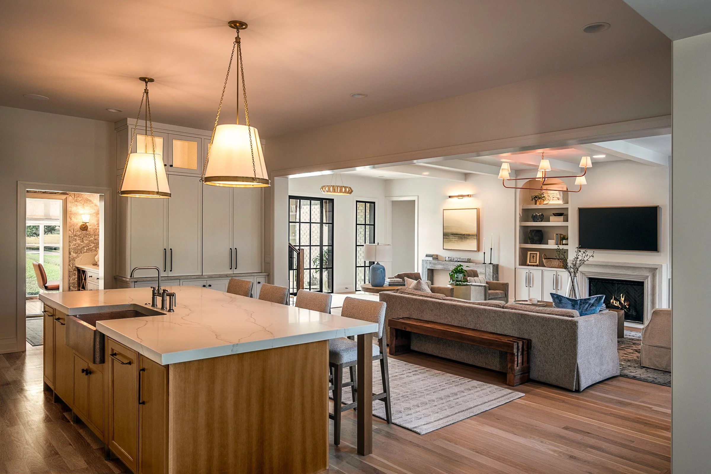Architectural and interior photography of a custom home in Nashville, Tennessee, designed by Origin Architecture and photographed by Paul Lange of Lange Photo Studio. Warm light from the home’s fixtures highlights thoughtful architectural details and