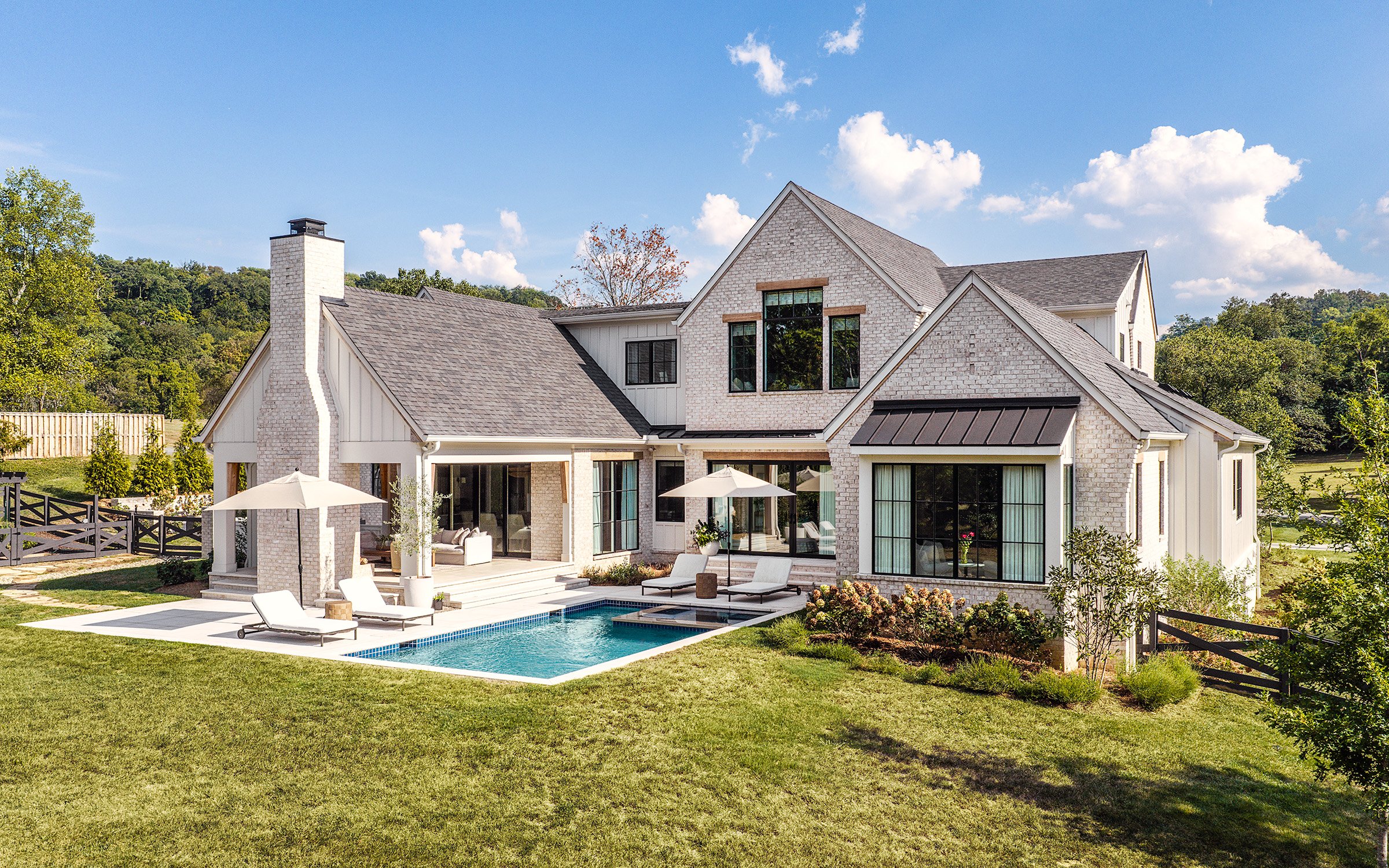 Architectural and interior photography of a custom home in Nashville, Tennessee, designed by Origin Architecture and photographed by Paul Lange of Lange Photo Studio. Warm light from the home’s fixtures highlights thoughtful architectural details and