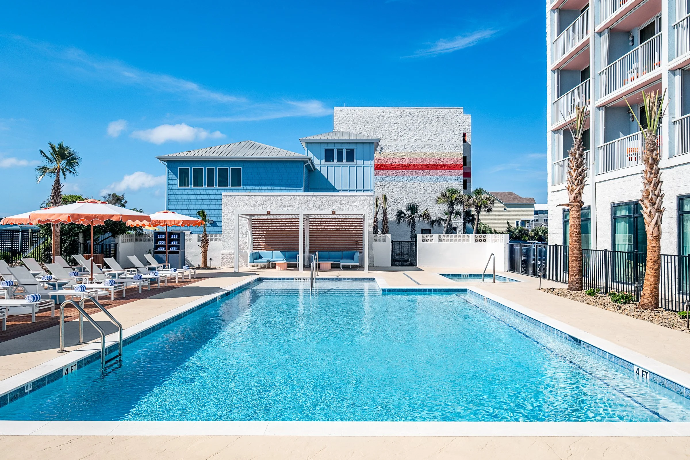 New Pool area photography at Golden Sands Hotel, showing thoughtful composition, branded consistency, fun, and uncluttered guest environment. Photographed by Lange Photo Studio. 