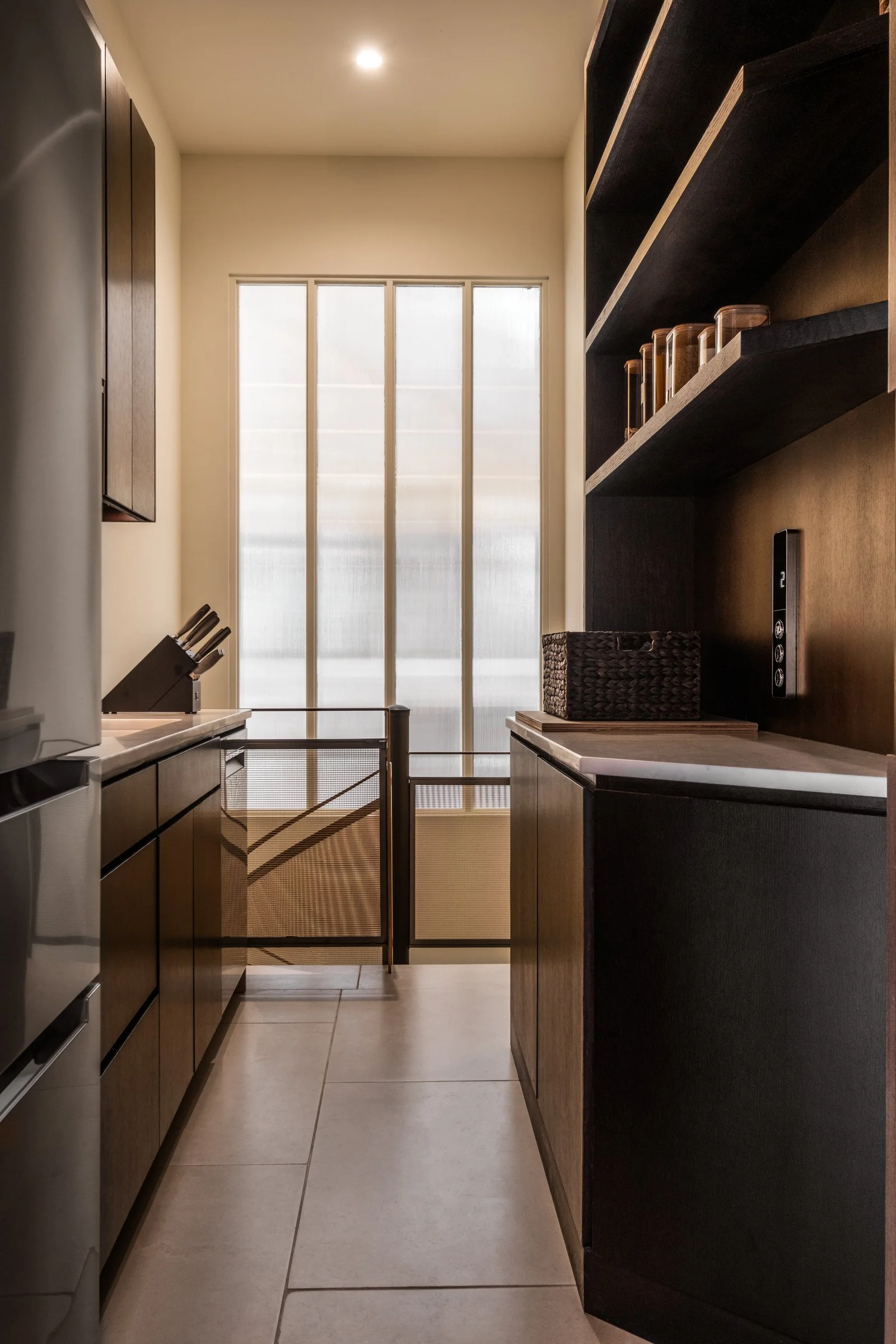 Architectural and interior photography of a customized lakefront home, highlighting design detail, atmosphere, infinity pool, and craftsmanship.