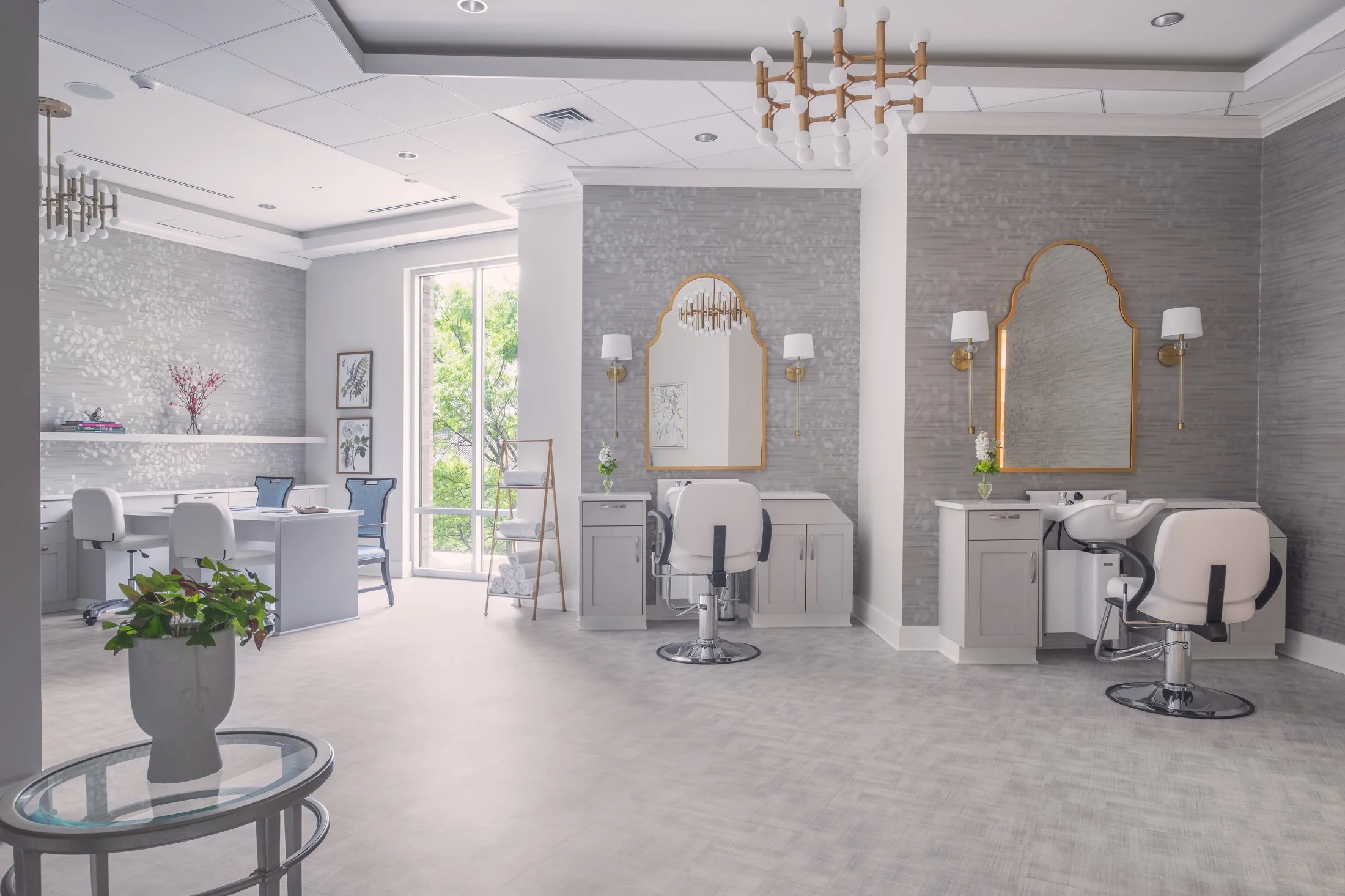 Spacious modern salon of Village on Morehead featuring natural light, contemporary amenities, and architectural details