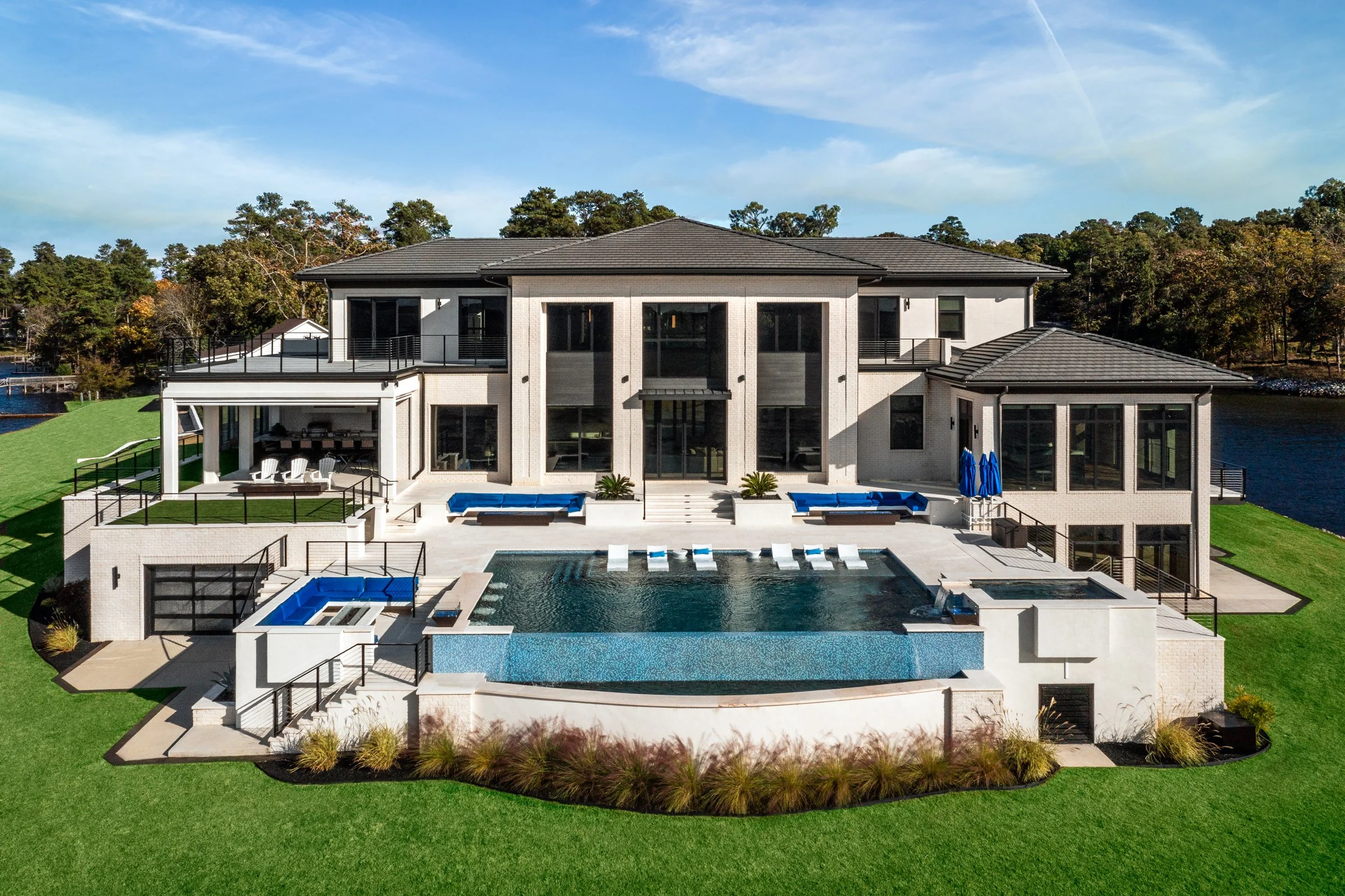 Architectural and interior photography of a customized lakefront home, highlighting design detail, atmosphere, infinity pool, and craftsmanship.