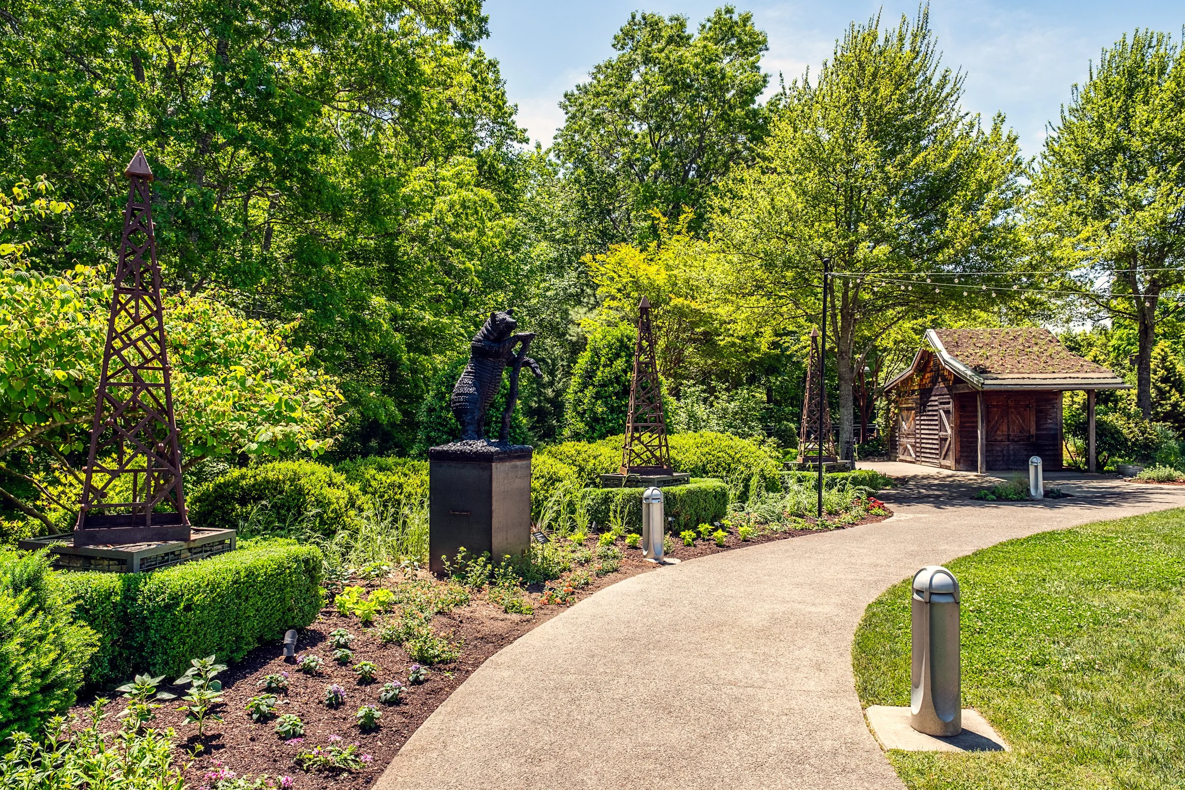 A quiet garden path and bonsai display at the North Carolina Arboretum near Asheville, North Carolina. Photographed by Lange Photo Studio. 