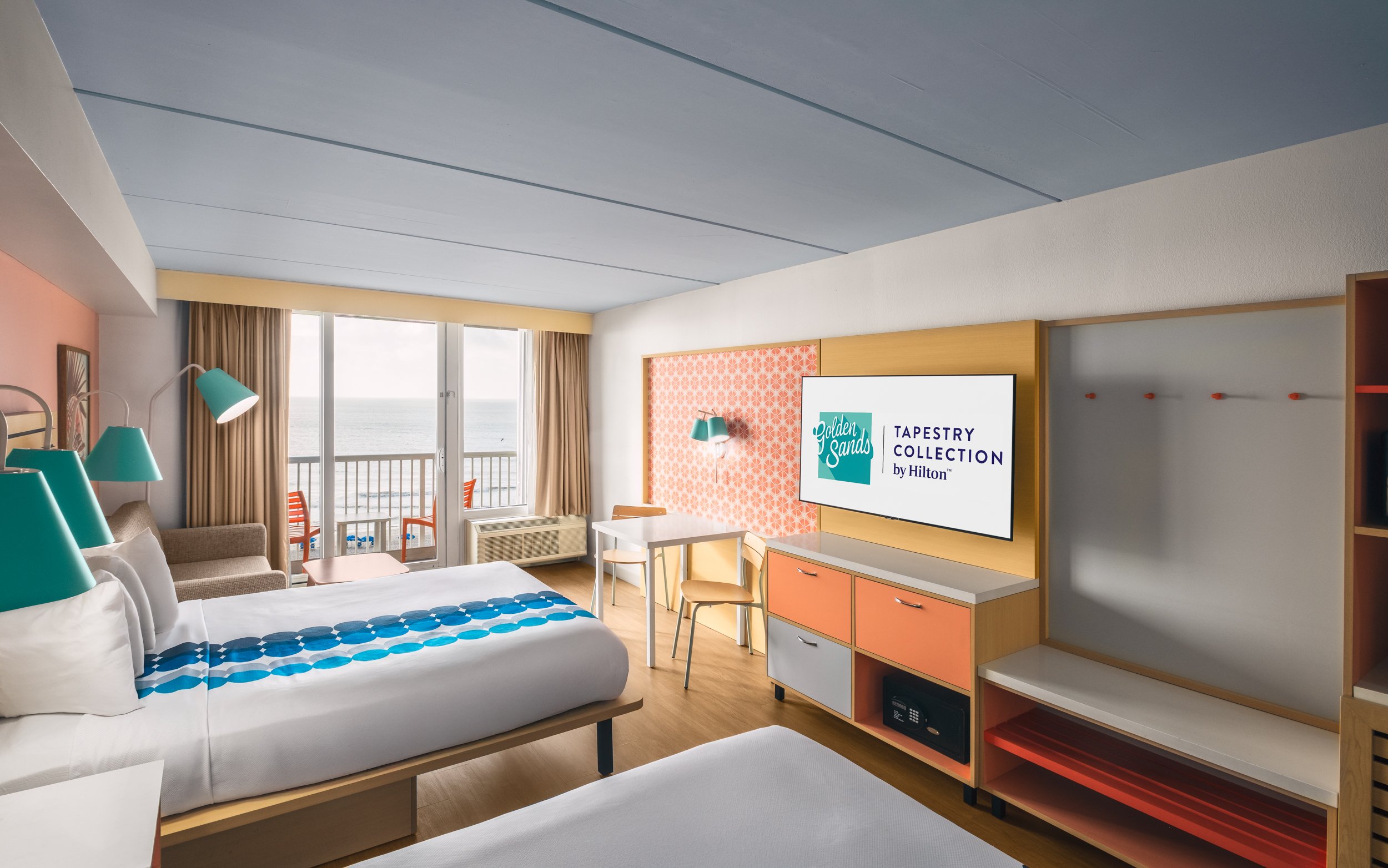 Photograph of guest room at Golden Sands Hotel, featuring crisp lighting, minimalist setup, and adherence to Hilton guest-ready standards.