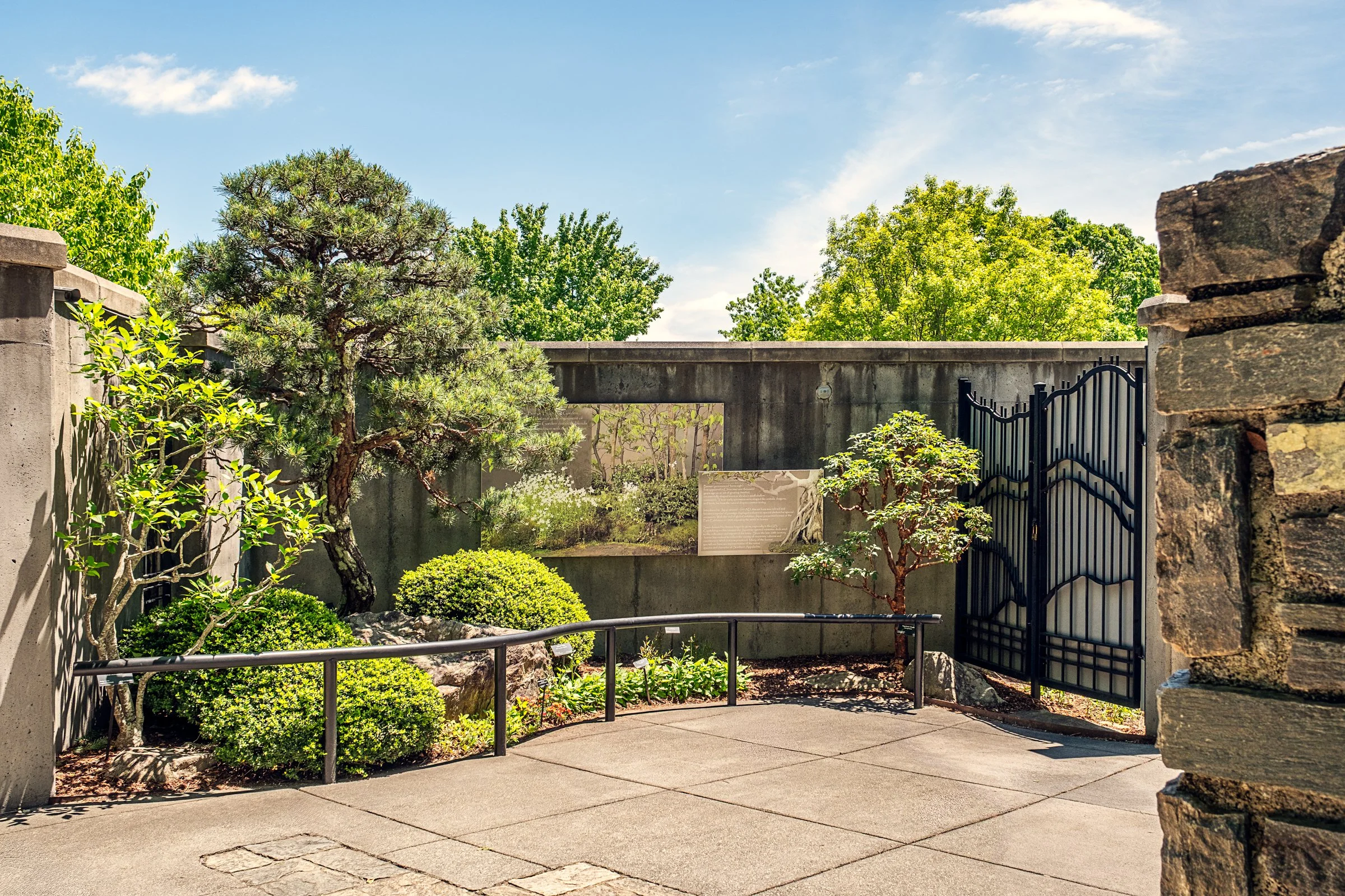 A quiet garden path and bonsai display at the North Carolina Arboretum near Asheville, North Carolina. Photographed by Lange Photo Studio. 