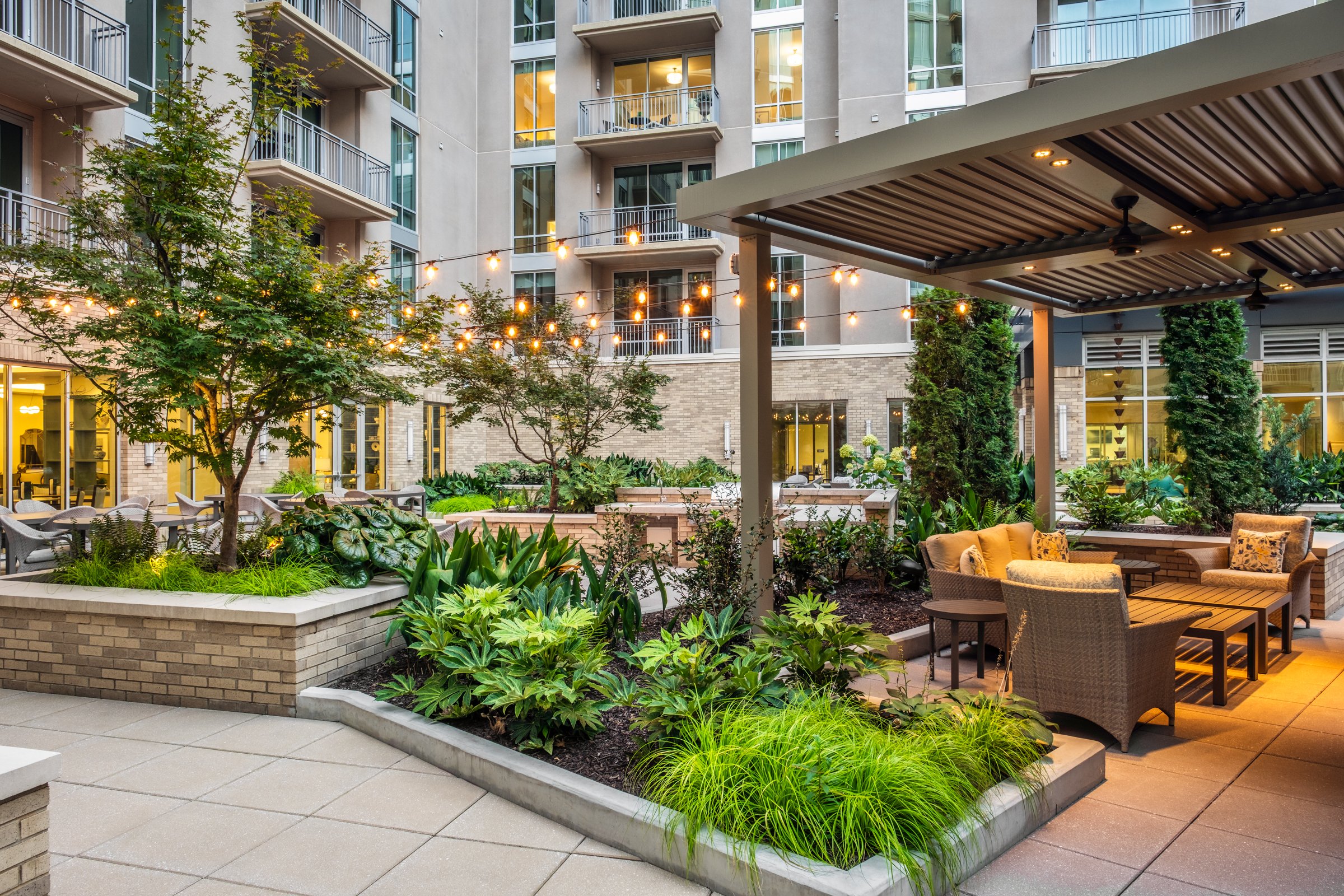 Village on Morehead a 55+ luxury senior living community showcasing the amenity courtyard, landscape design, by LandDesign in Charlotte, NC. Created by Lange Photo Studio.