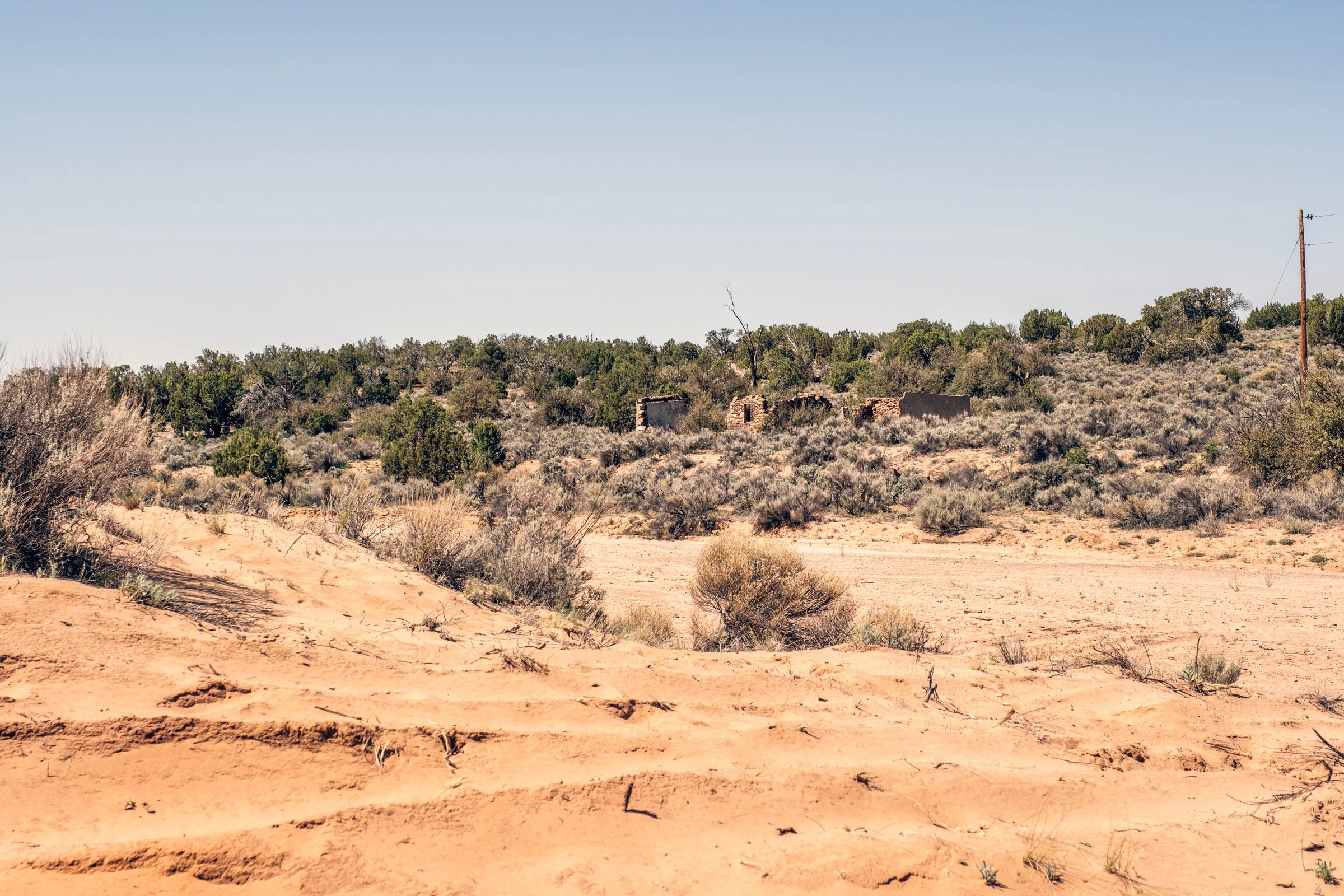 Hauling Life | Navajo Nation — Unified Metadata Paragraphs

Wayne Wilson and Joann Whiting collect water in Gallup, New Mexico at a community water source. The containers are filled, prepared, and loaded into their vehicle for transport across the Na