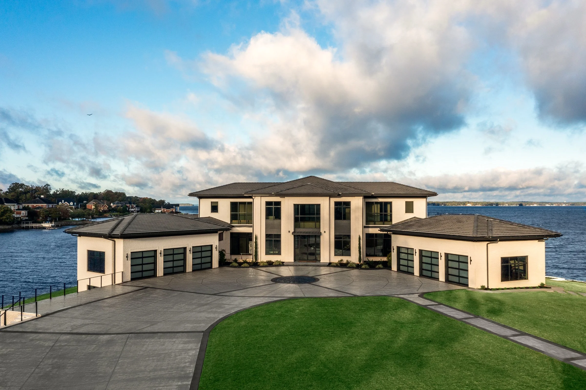Architectural and interior photography of a customized lakefront home, highlighting design detail, atmosphere, infinity pool, and craftsmanship.