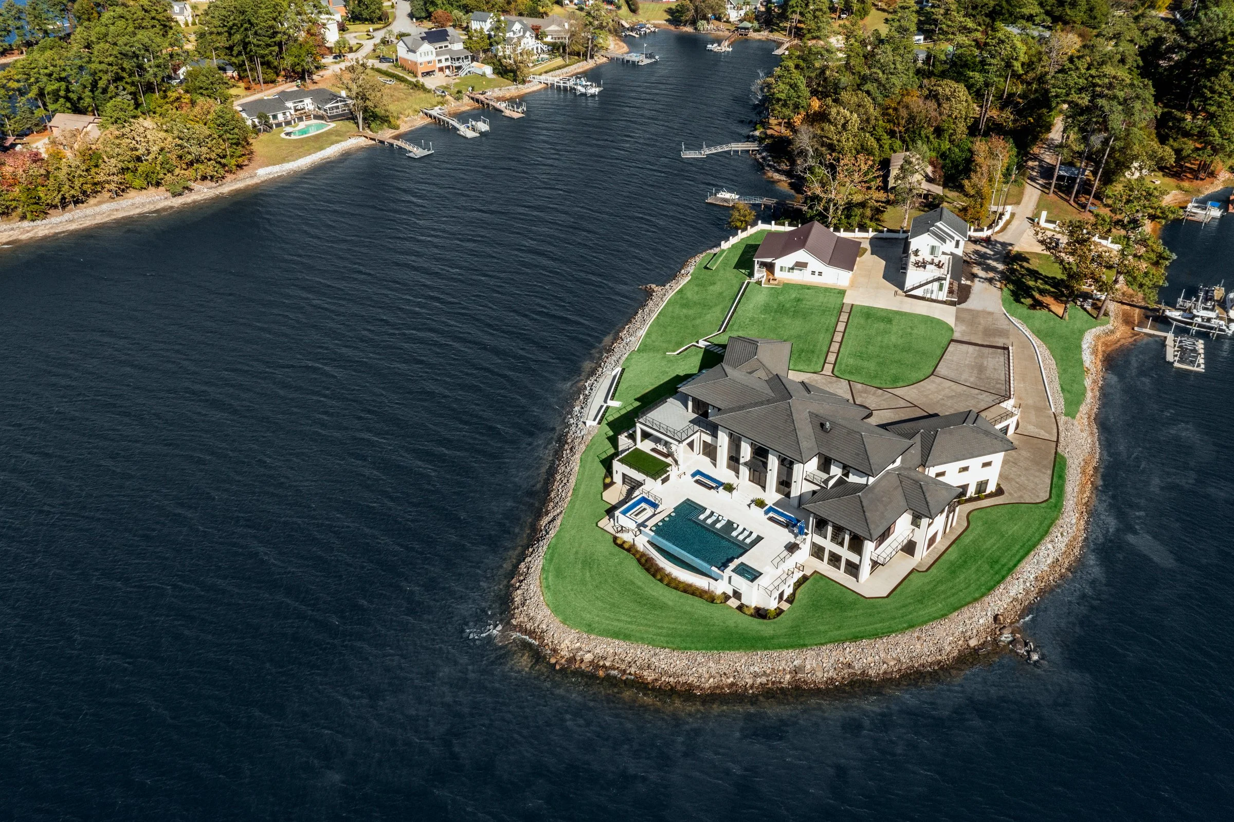 Architectural and interior photography of a customized lakefront home, highlighting design detail, atmosphere, infinity pool, and craftsmanship.