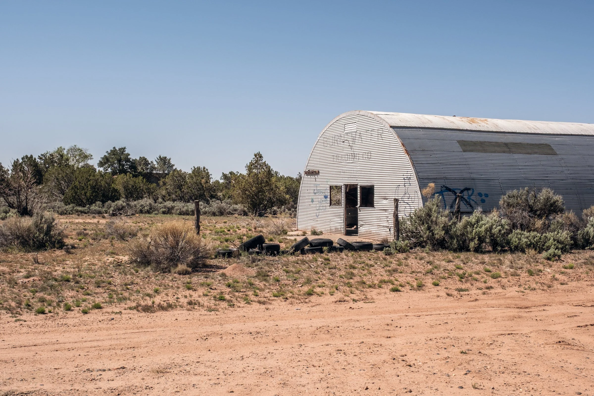 Hauling Life | Navajo Nation — Unified Metadata Paragraphs

Wayne Wilson and Joann Whiting collect water in Gallup, New Mexico at a community water source. The containers are filled, prepared, and loaded into their vehicle for transport across the Na