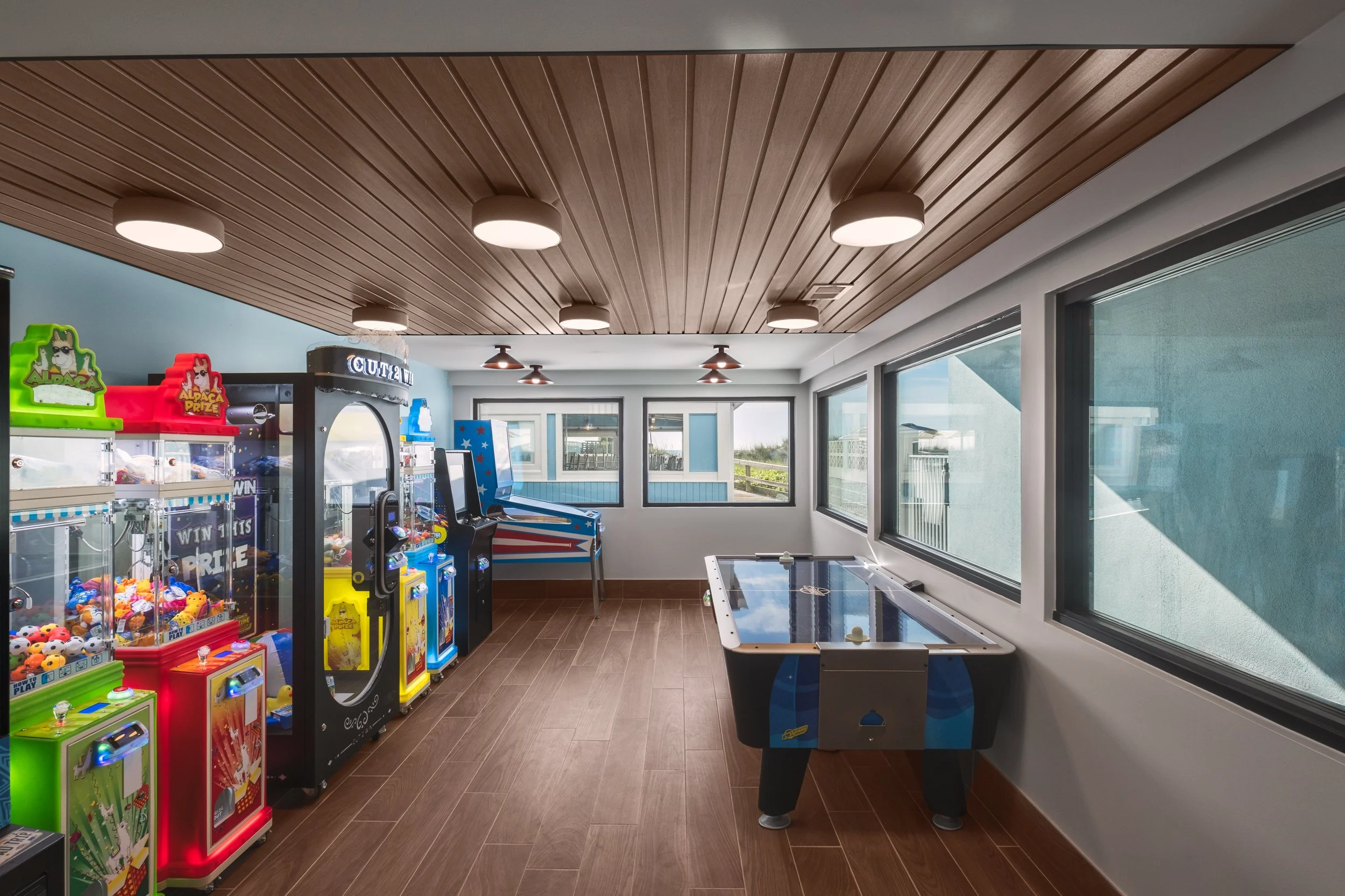 Interior architectural shot of the Golden Sands Hotel arcade corridor, combining elegant ambient lighting with uncluttered design and guest-focused staging.